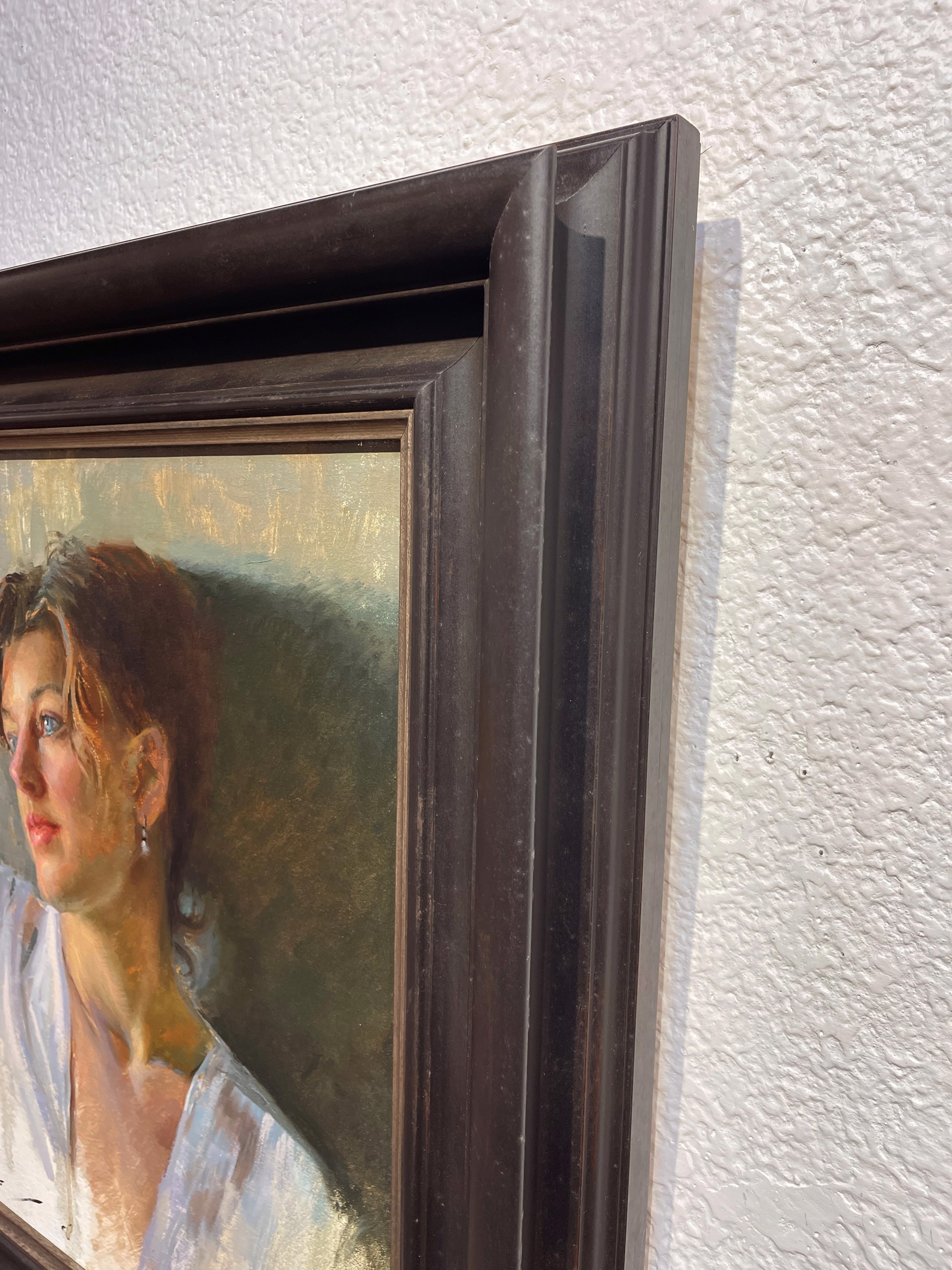A soft-focus portrait of a person in a white blouse, rendered with loose brushwork and warm lighting.