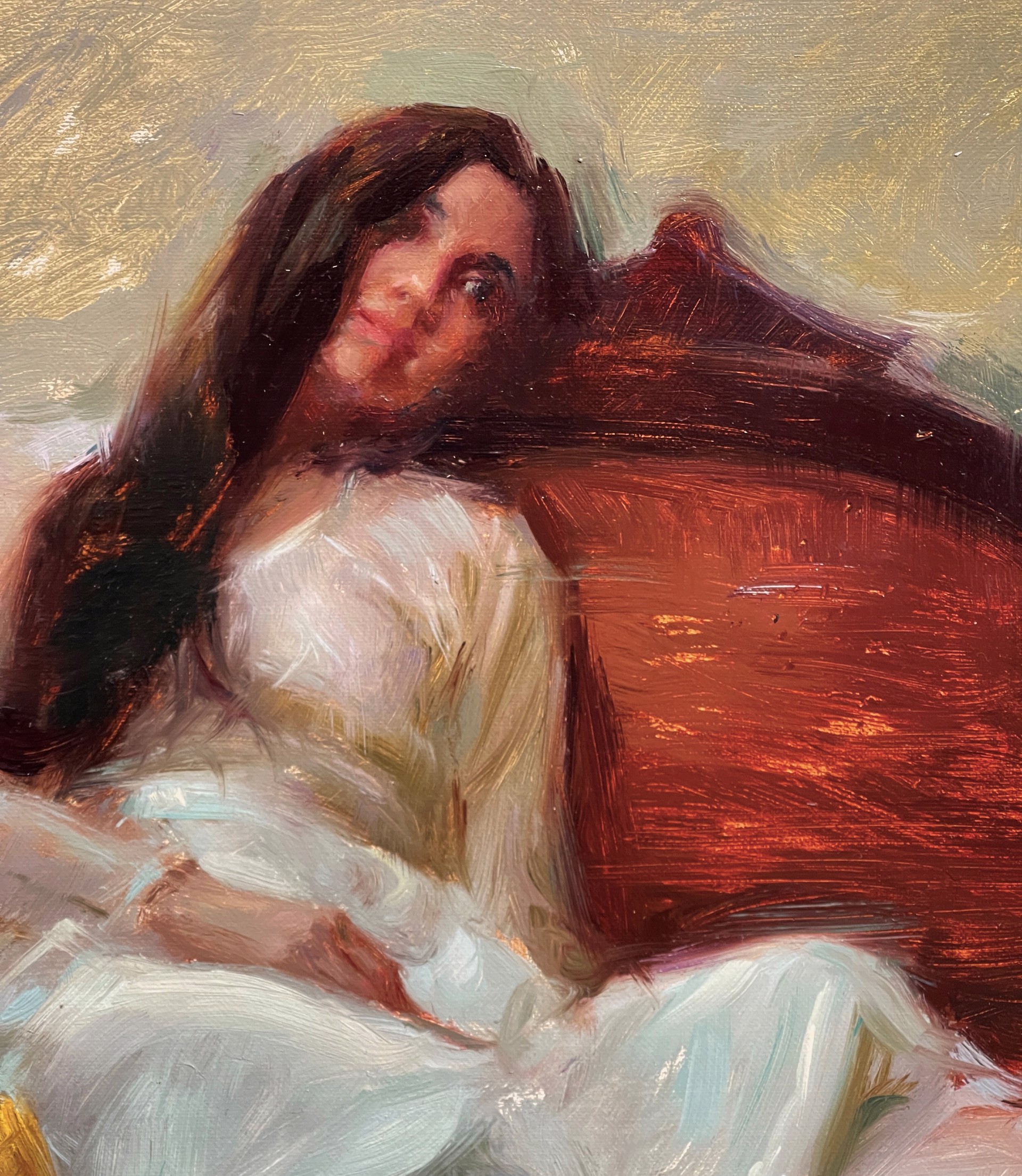 A painting of a woman sitting on a couch with a vase of flowers.