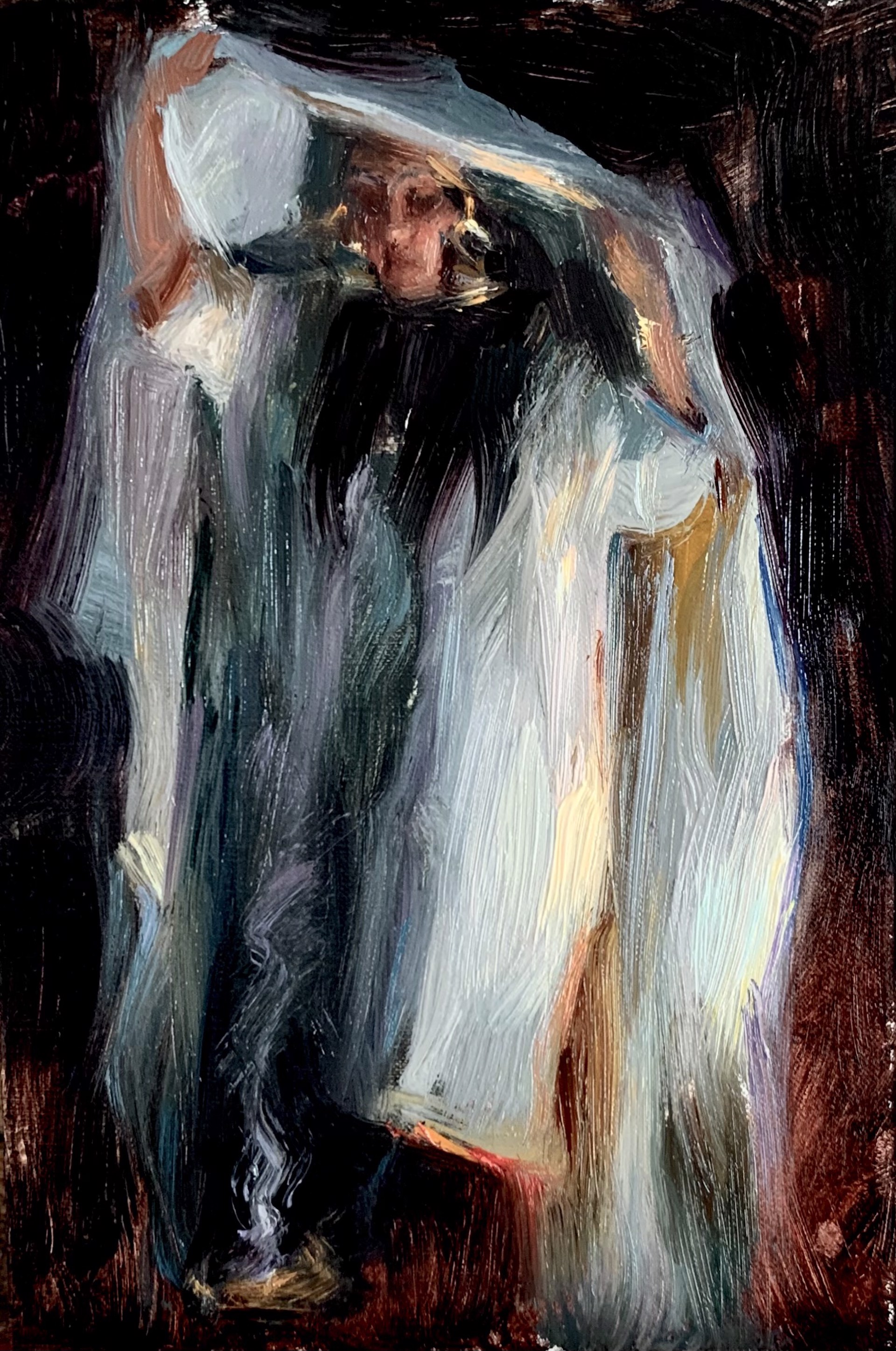 A dramatic portrait of a figure in dark clothing holding up a white cloth against a black background.