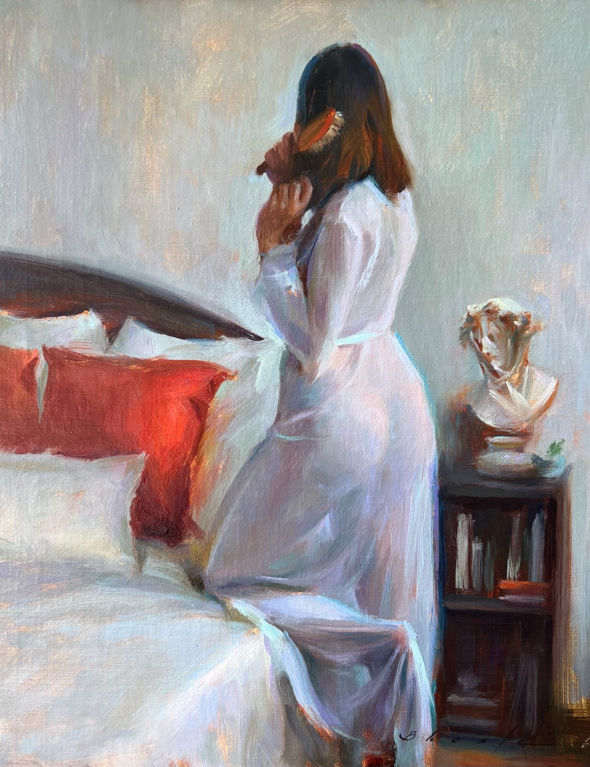 A figure in a white robe stands beside a bed, holding a small object to their face.
