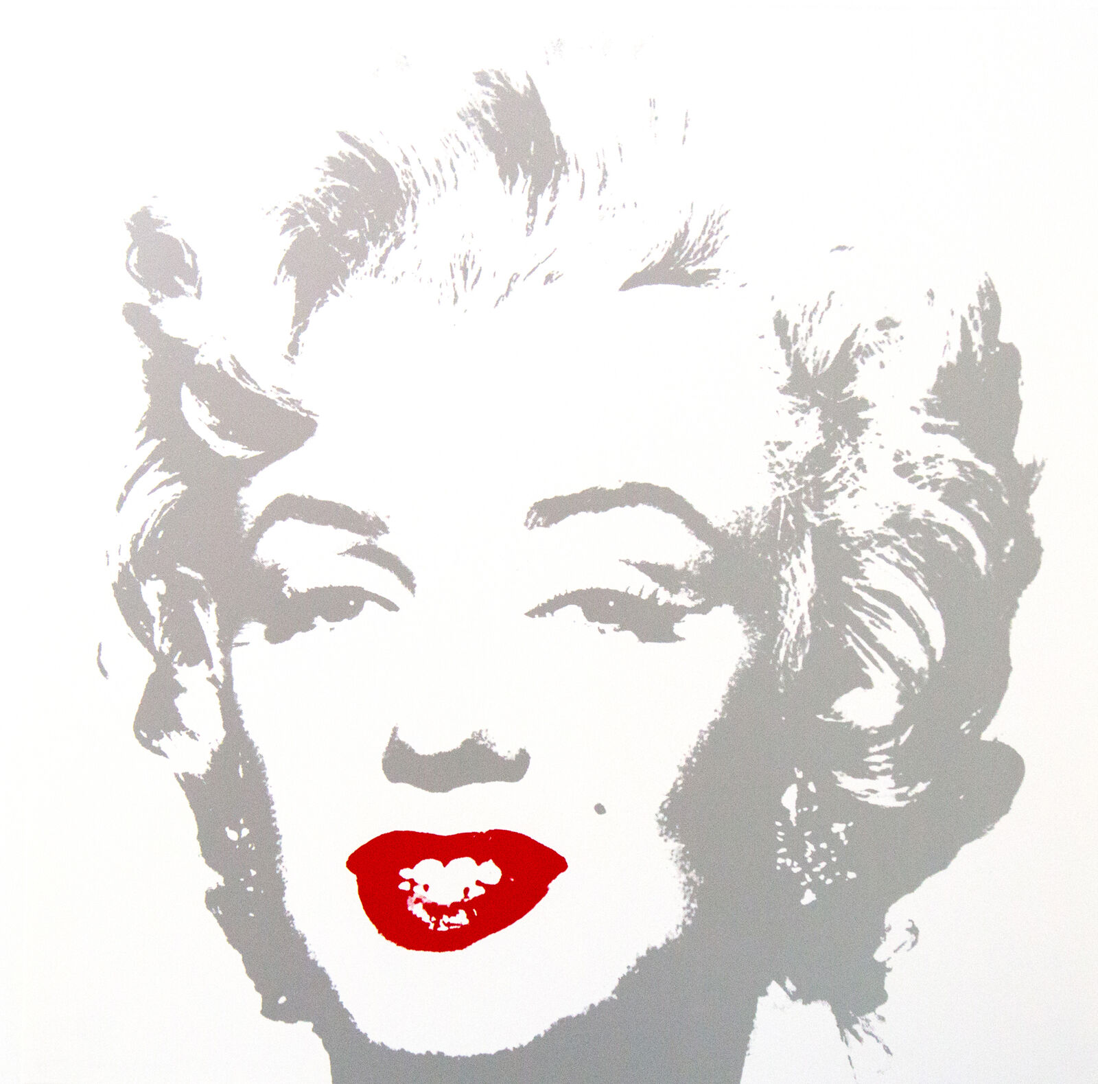 A picture of a woman with a red lipstick on her lips.