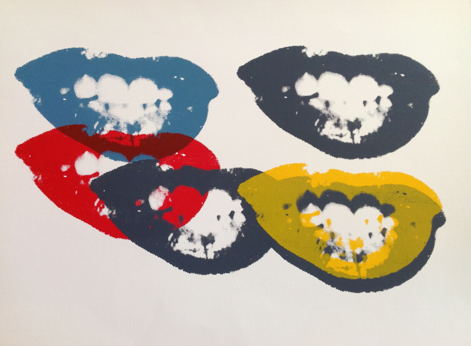 A close up of three different colored lips on a white background.