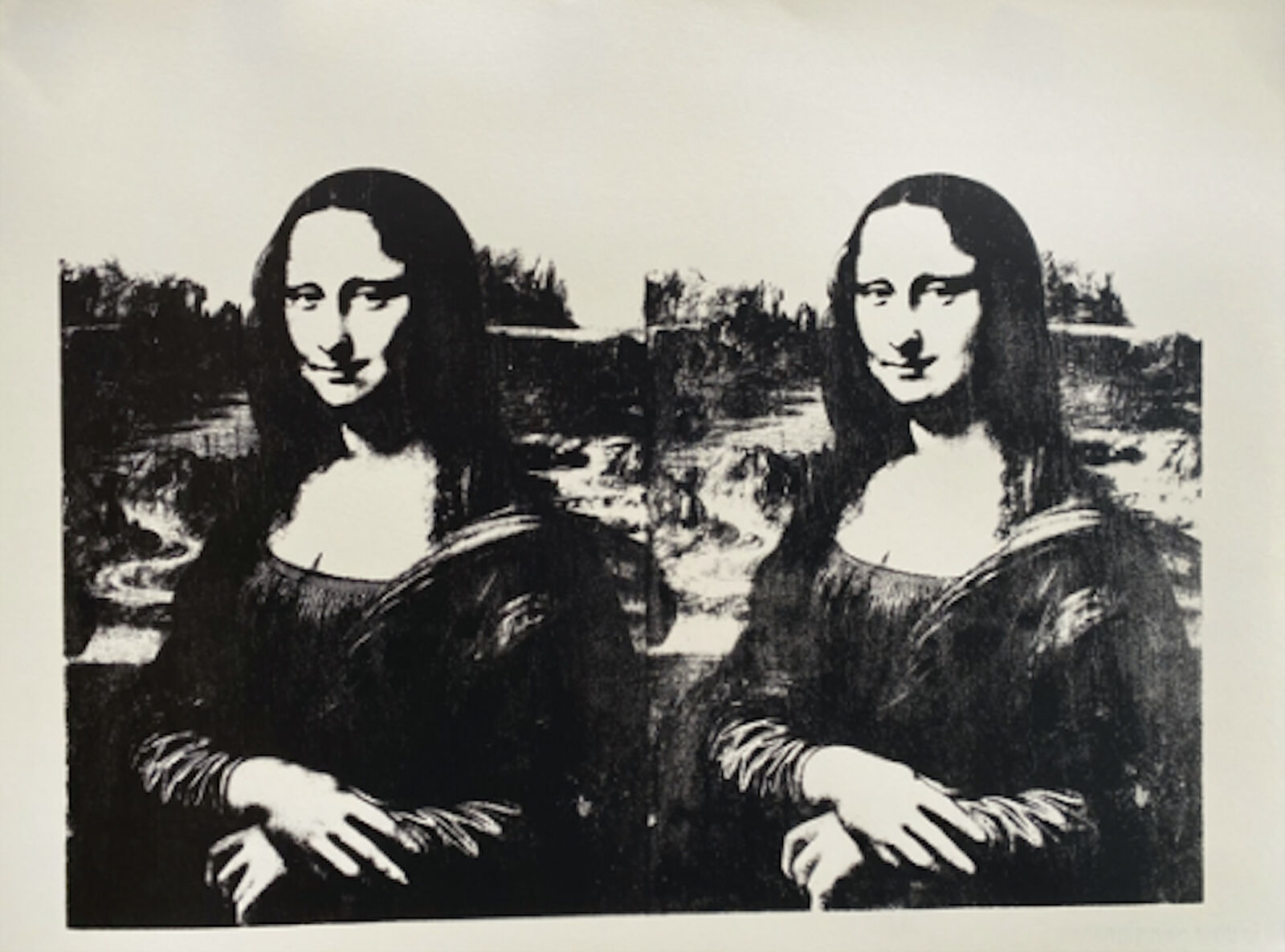 A black and white photo of two Mona Lisa paintings.