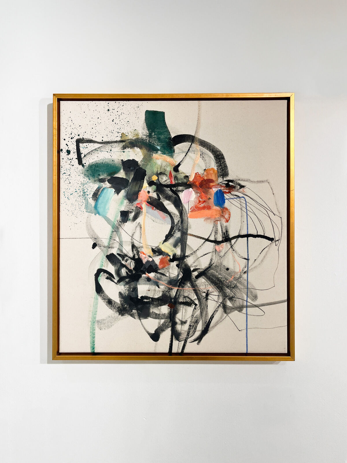 An abstract expressionist composition featuring a face-like form constructed from bold black ink, splattered colors, and gestural lines.