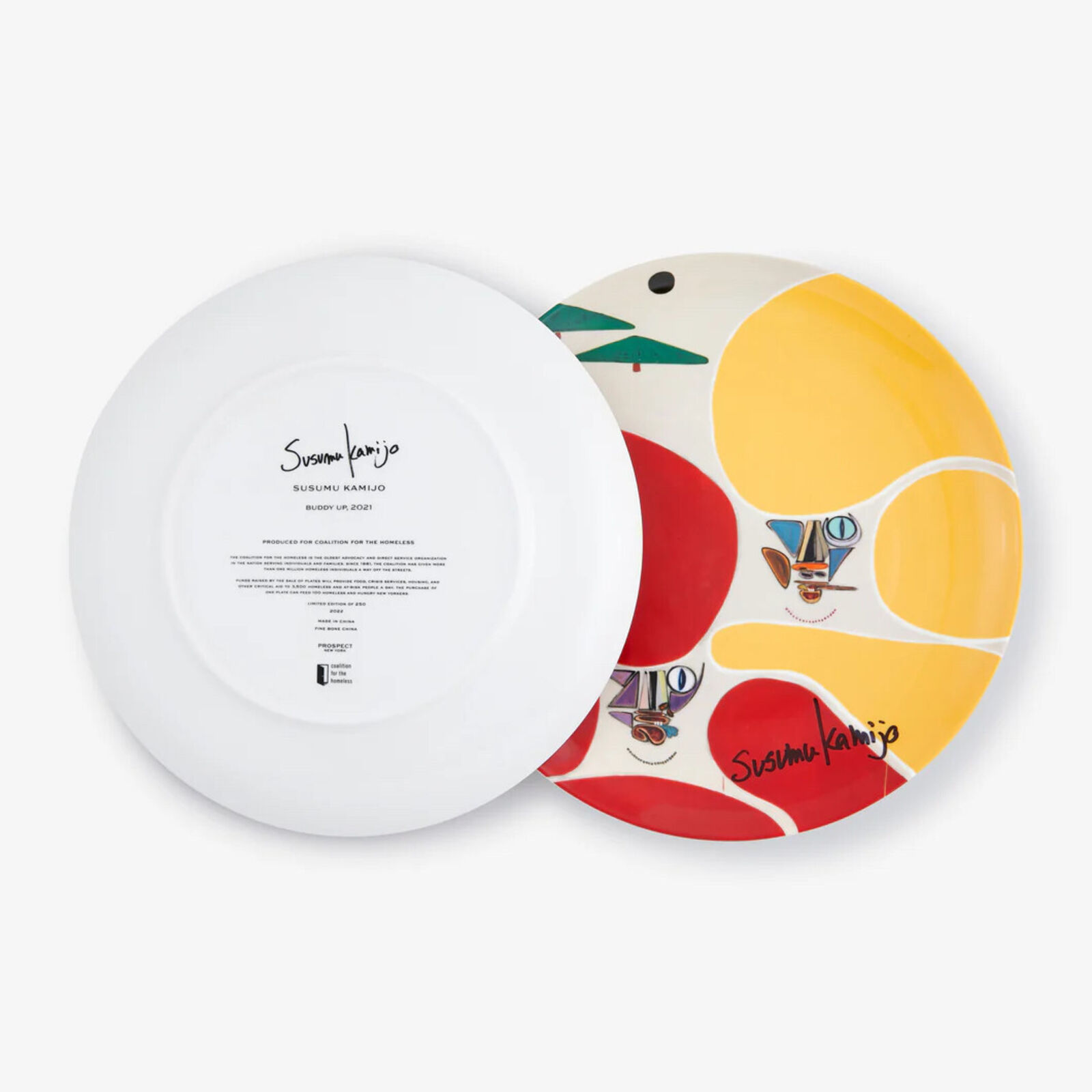 A red and yellow plate with a cat face on it.