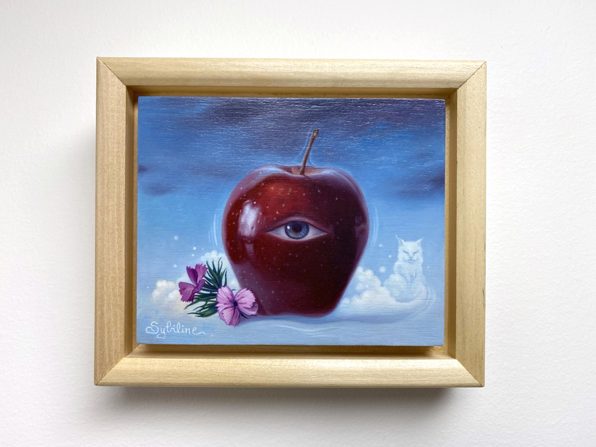 A painting of an apple with an eye and a cat in the sky.