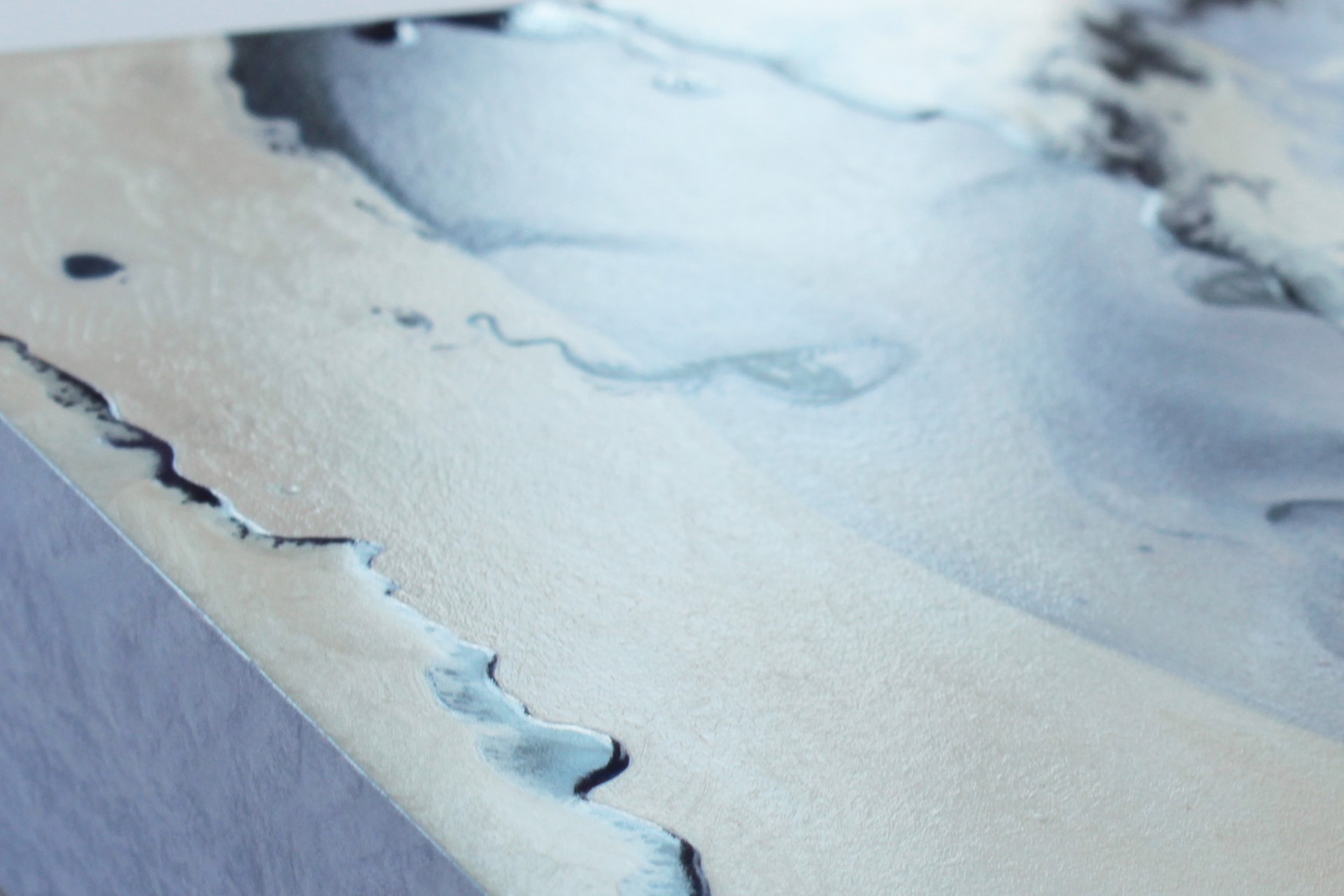 A painting of a woman's face peeking out of a hole in a wall.
