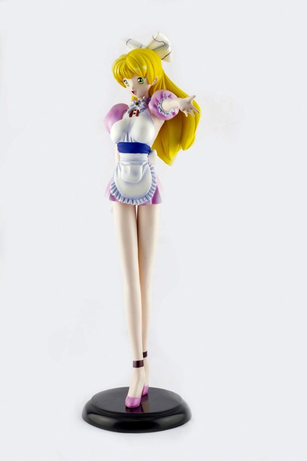 A figurine of a woman in a pink dress and white apron.