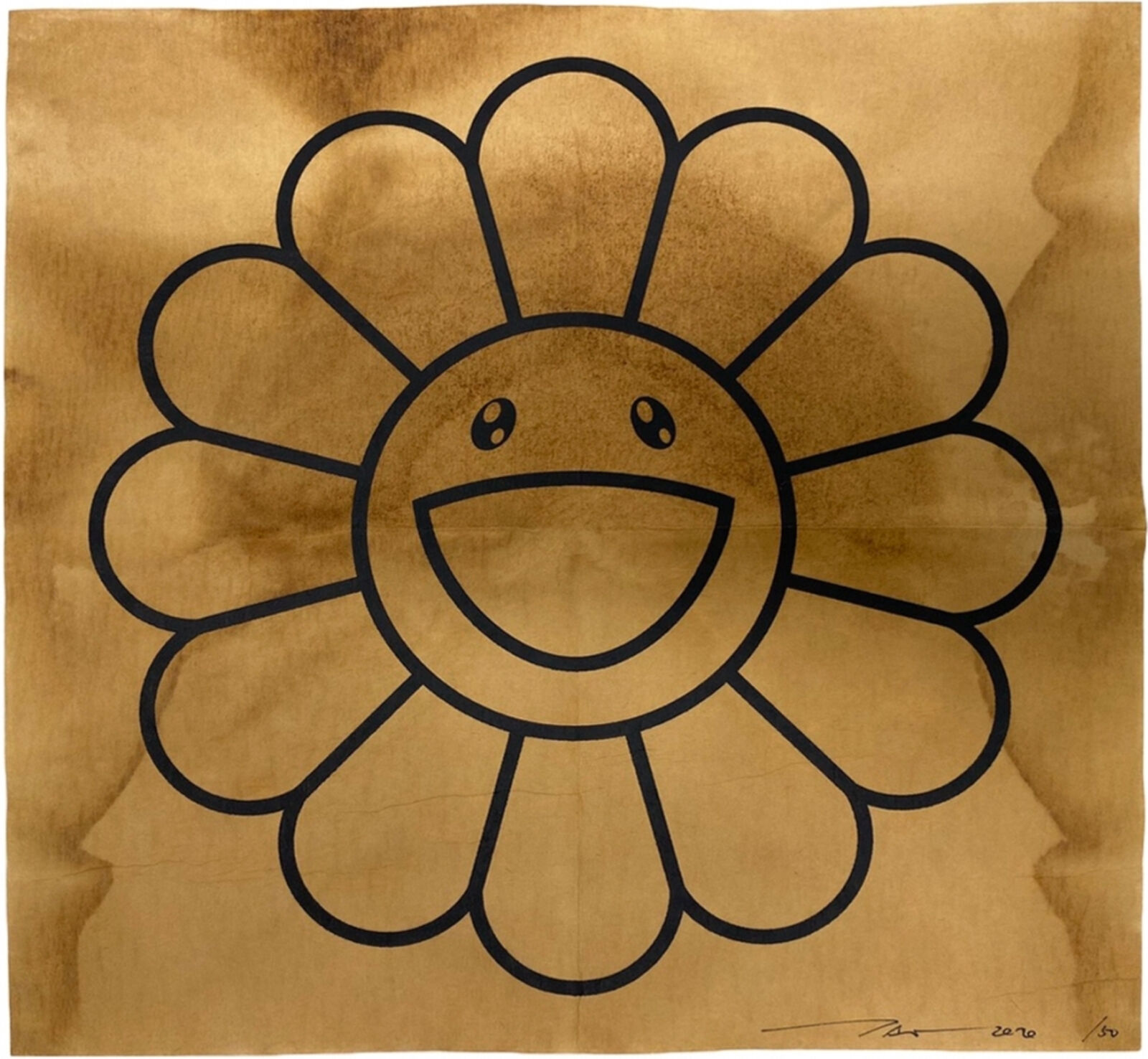 A drawing of a smiling flower on a piece of paper.