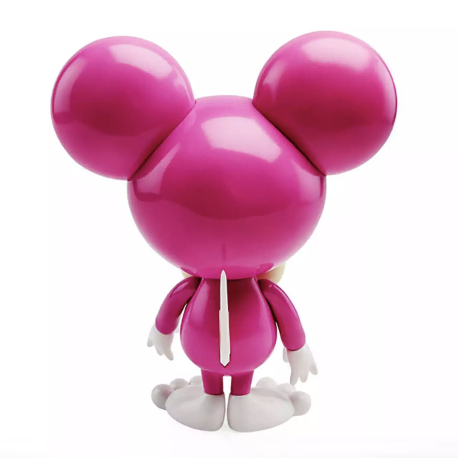 A pink and white toy with a bow tie on it's head.