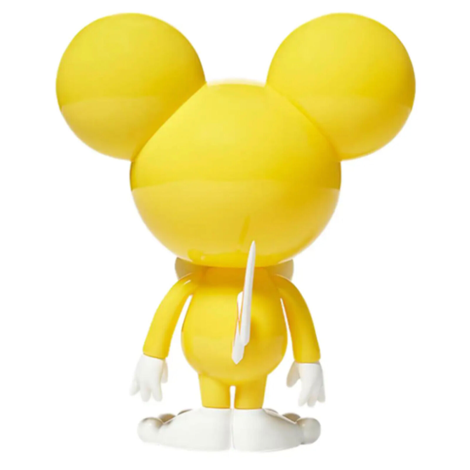 A yellow and white toy with a bow tie on it's head.