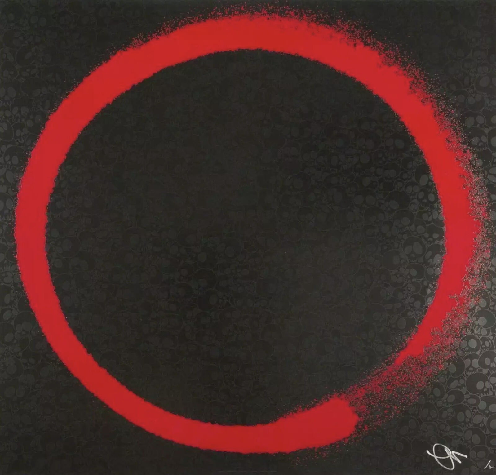 A red circle on a black background. 