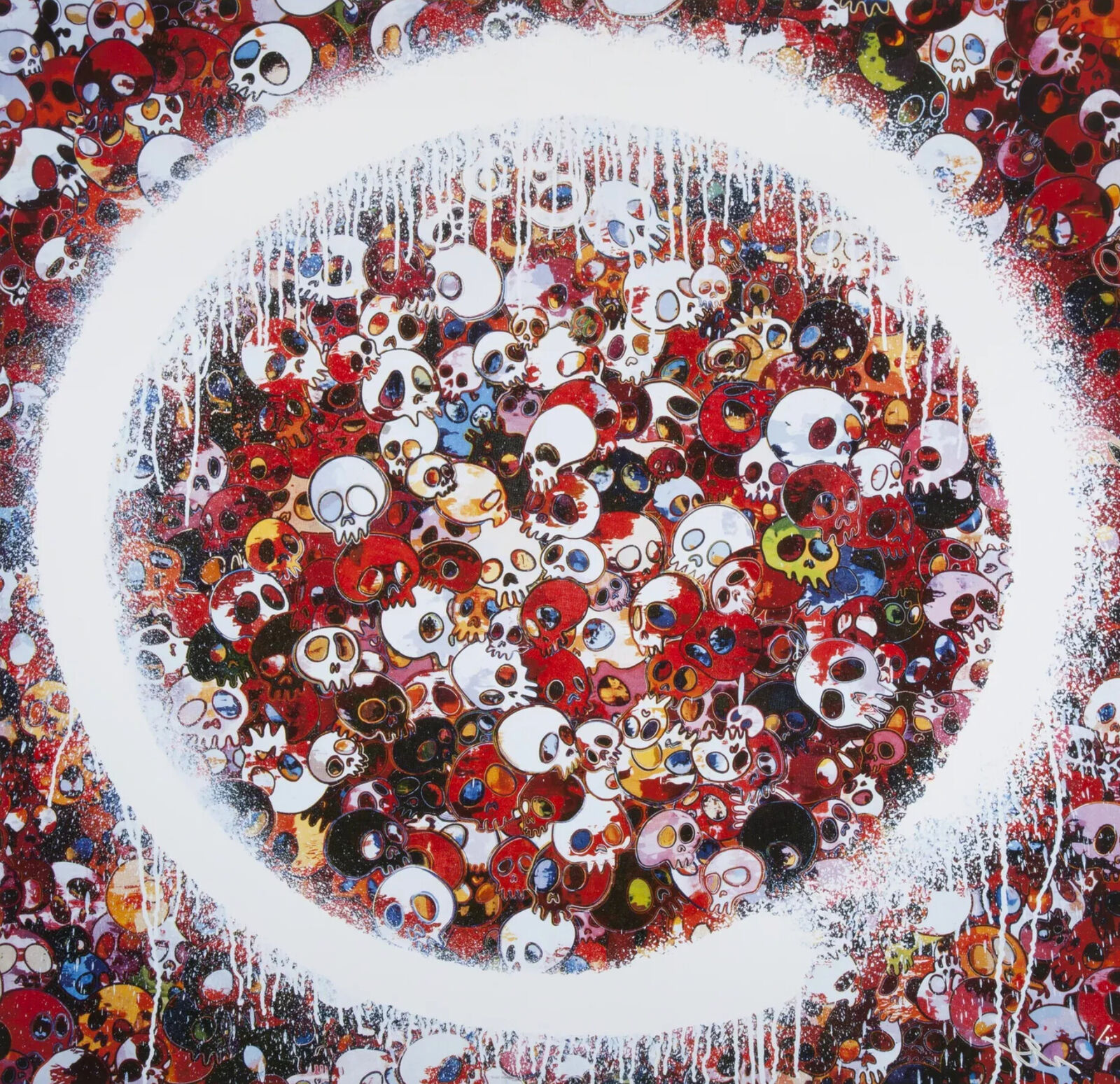A painting of many skulls in a circle on a wall.