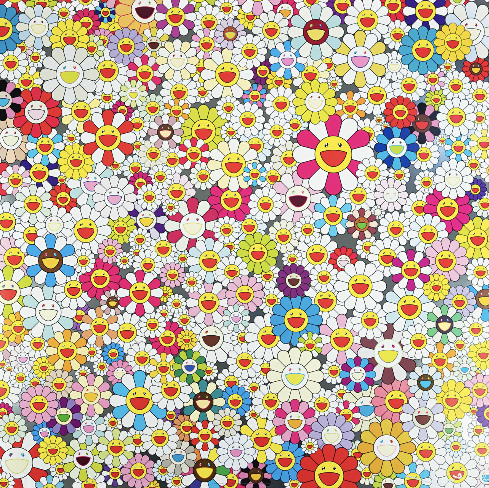 A large group of smiley faces in a field of flowers.