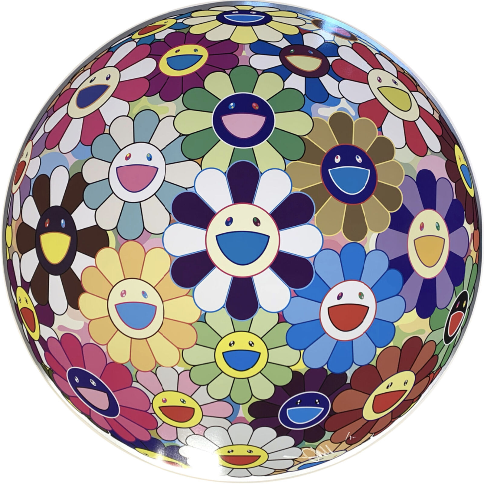 A colorful flower ball with smiley faces on it.