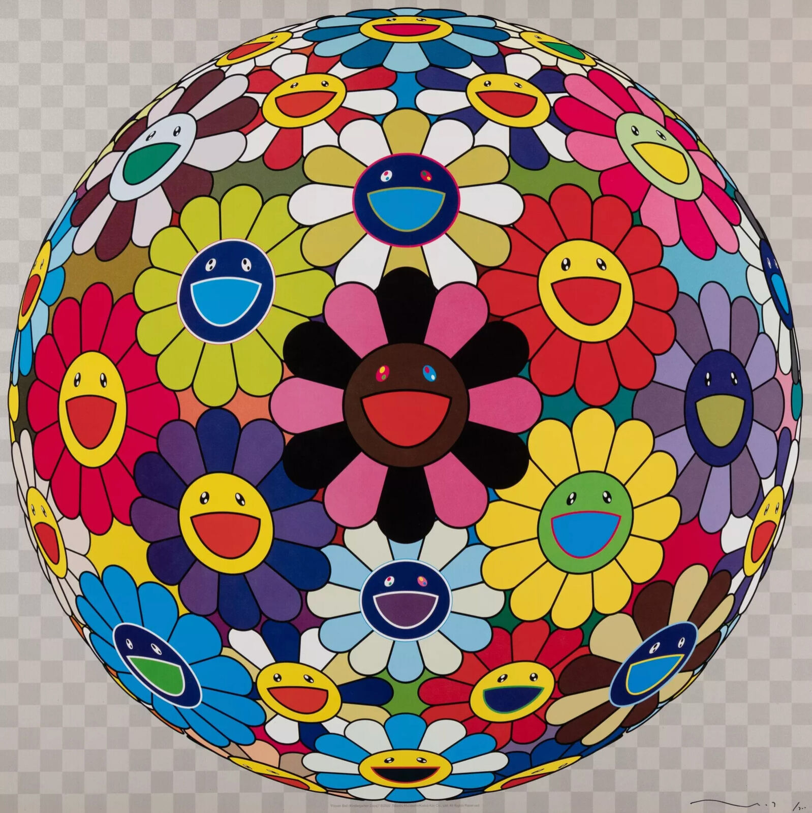 A colorful flower ball with smiley faces on it.