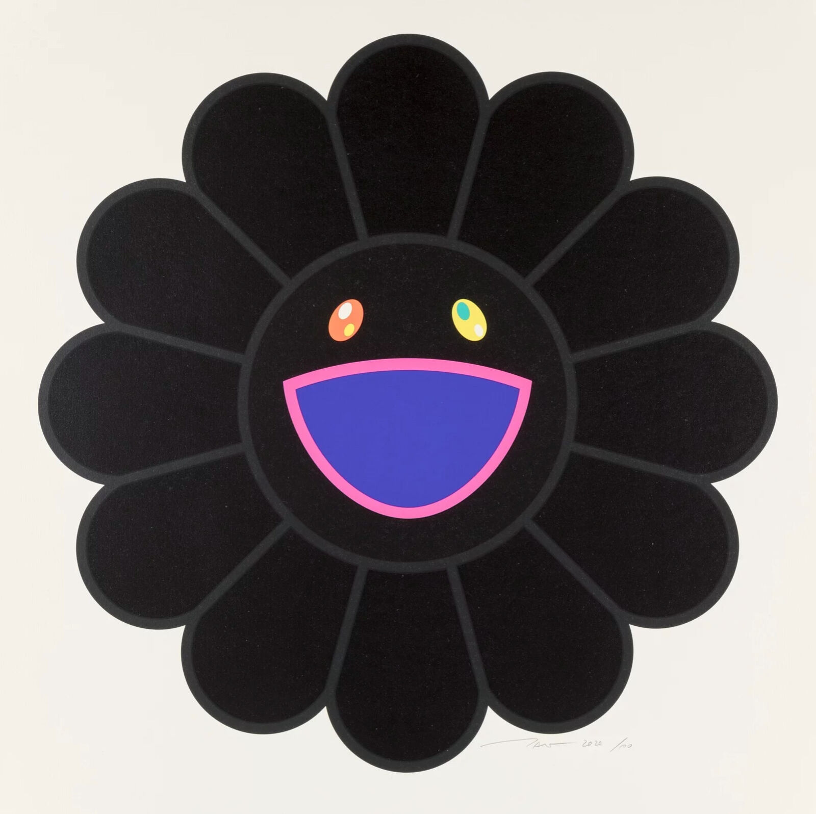 A black flower with a smiley face on it.