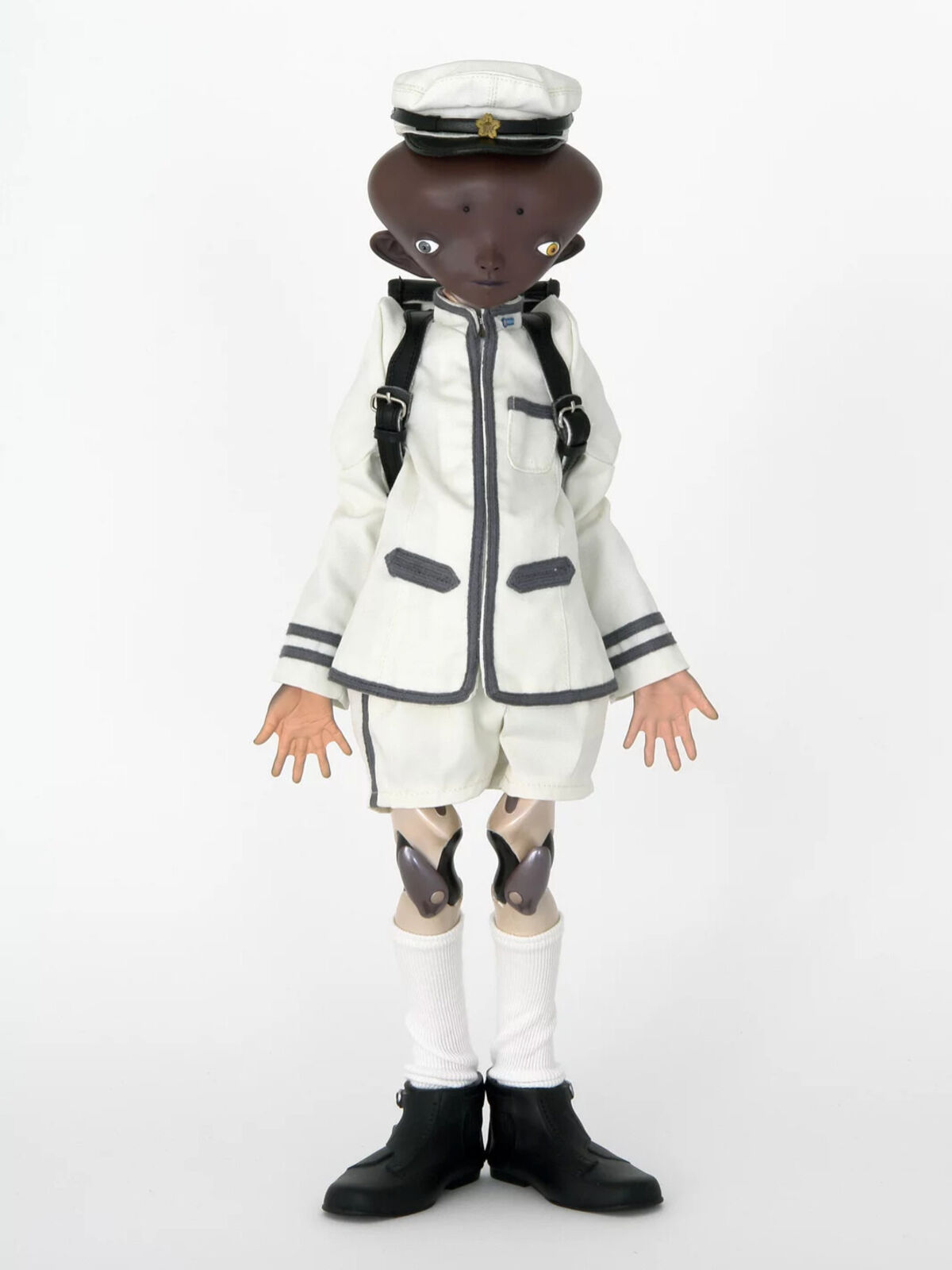 Artwork by Takashi Murakami, Inochi doll / Version: Bob, Made of Body: ABS and NP-PVC / Head: Iron plate / Uniform: Cotton and Polyester, Nylon / Shoes: Soft vinyl / School bag: Artificial leather and Metal / Cap: Cotton, Artificial leather, NP-PVC, Magnet, and Metal 