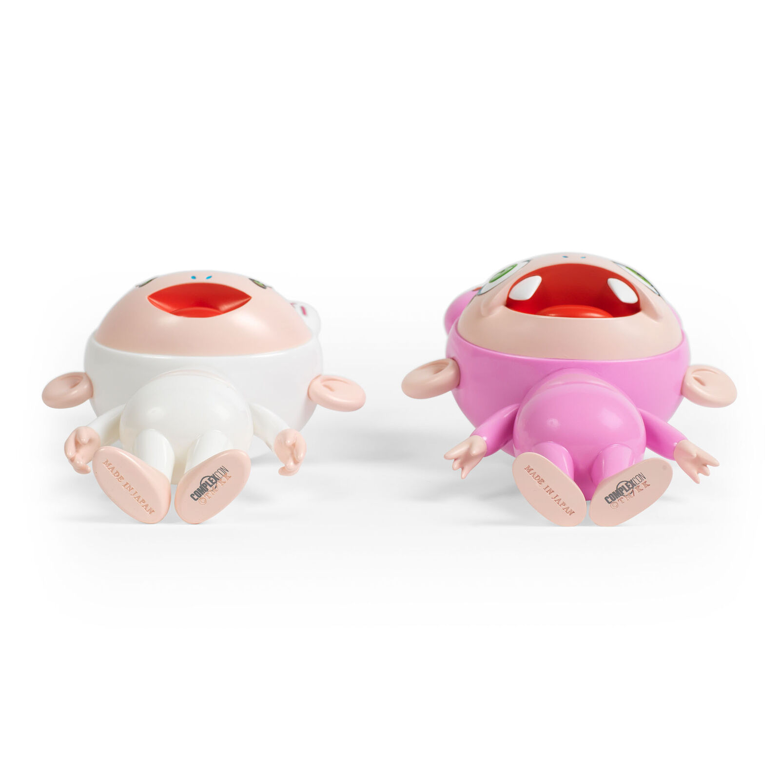 A couple of dolls that are standing next to each other.