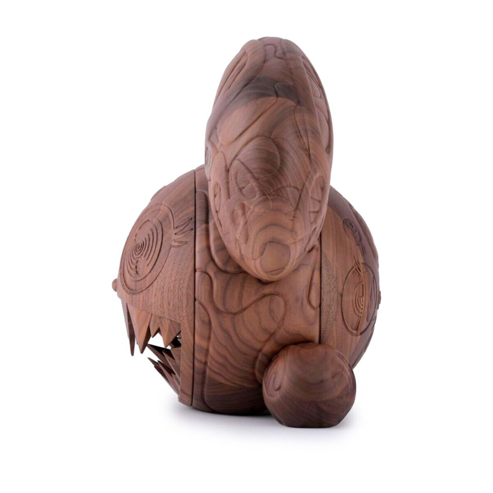 A wooden toy with a face carved into it.