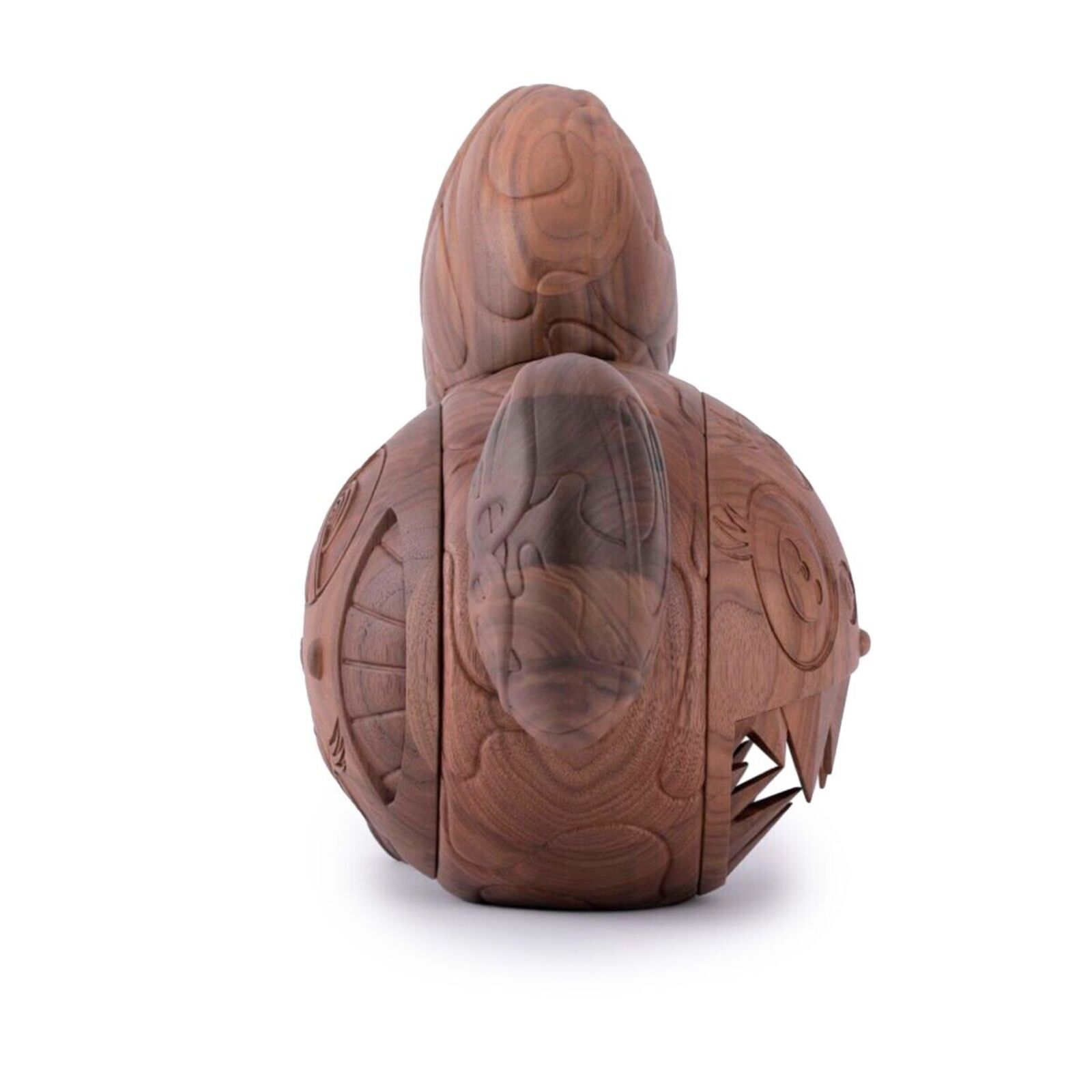 A wooden toy with a face carved into it.