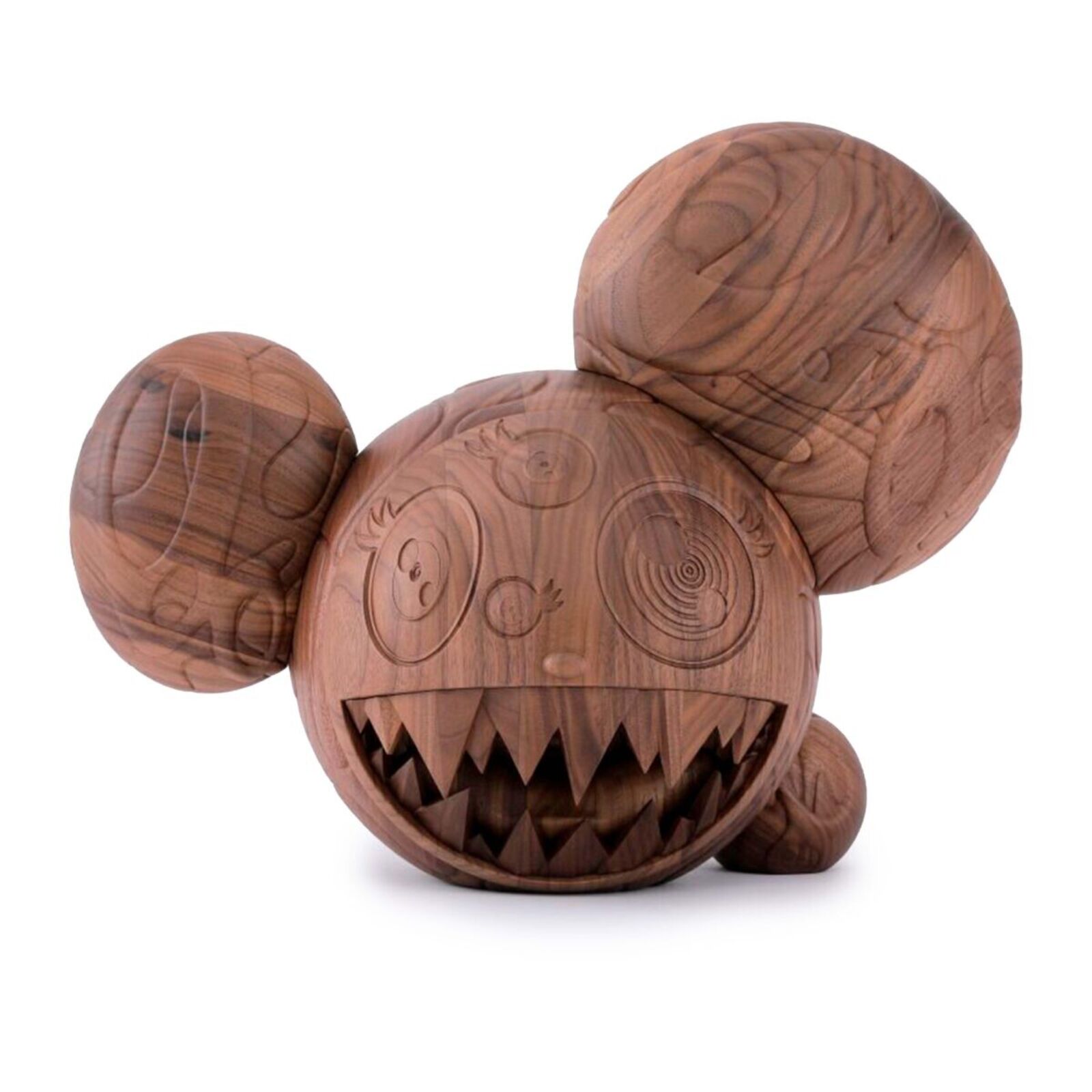 A wooden toy with a face carved into it.