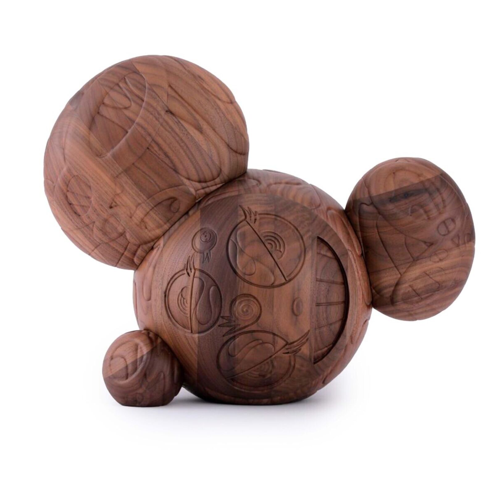 A wooden toy with a face carved into it.