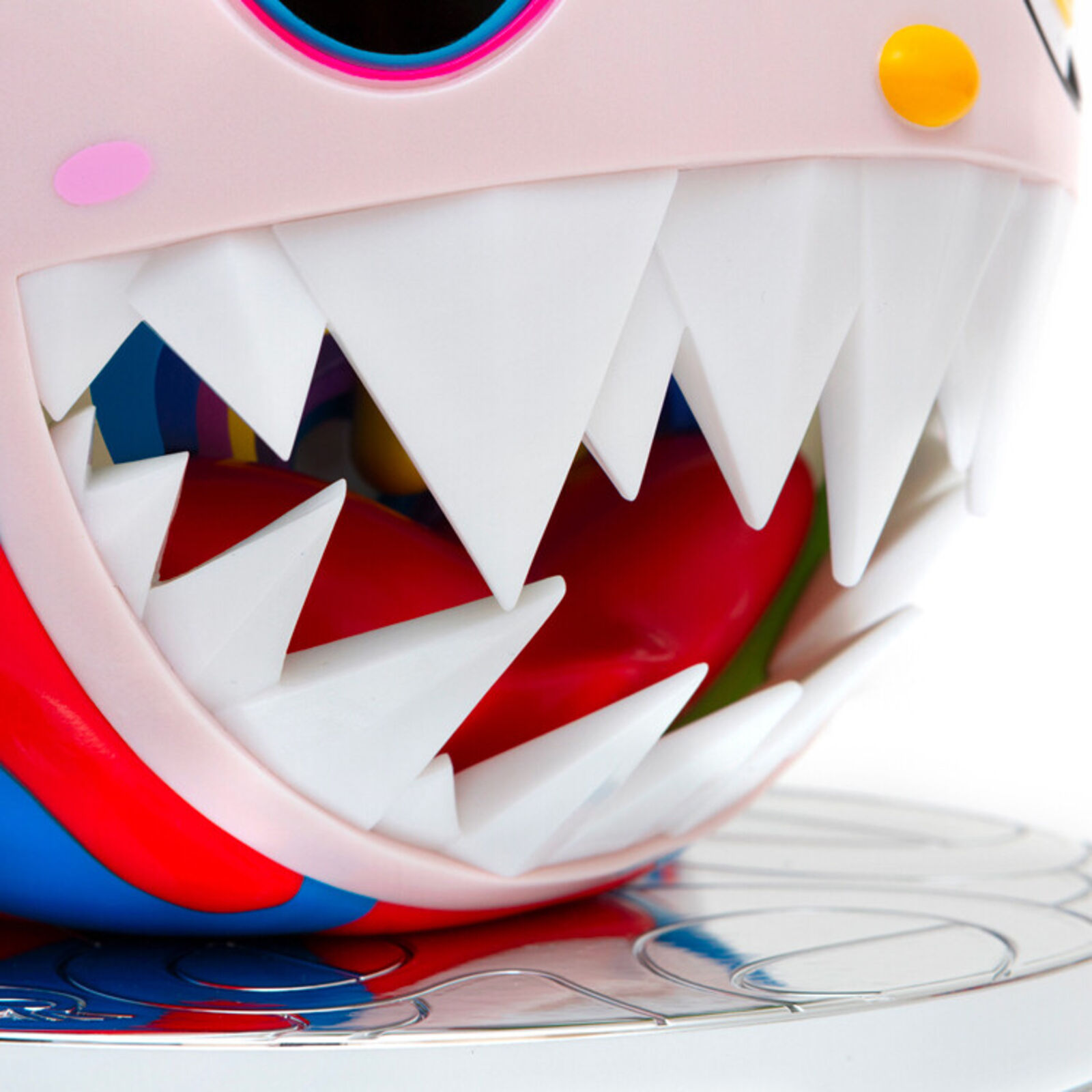 A red, white, and blue mickey mouse head with a big smile on it's face.