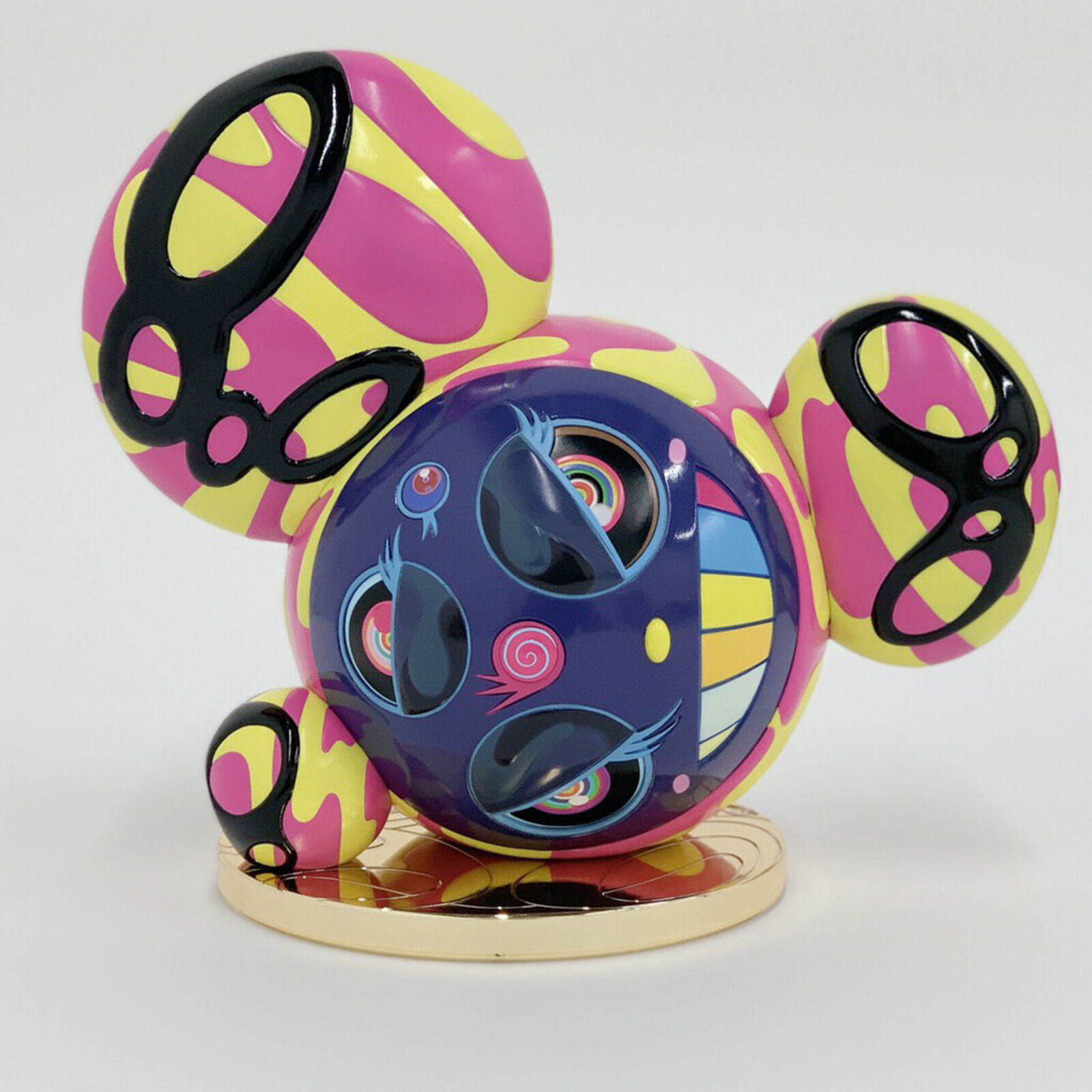 A colorful mickey mouse figurine on a white background.