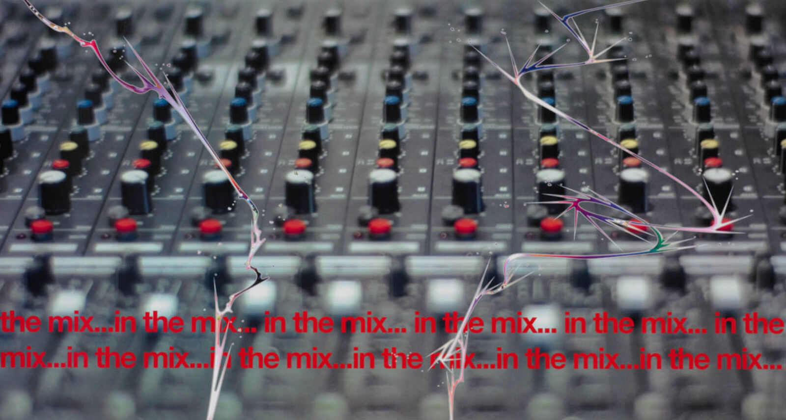 a close up of a mixing board with a bunch of wires on it