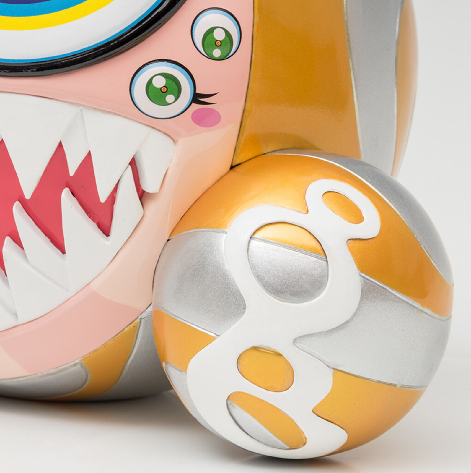 A close up of a toy with a big smile on its face.