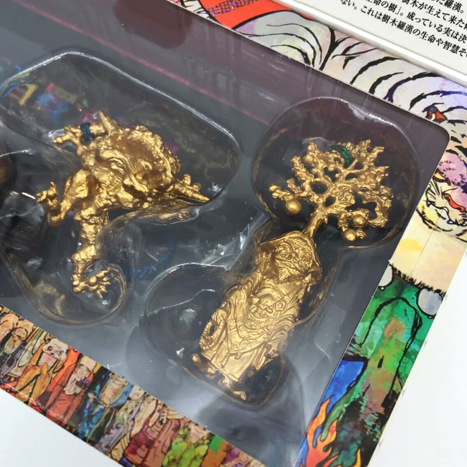 A box containing a variety of figurines in a display case.