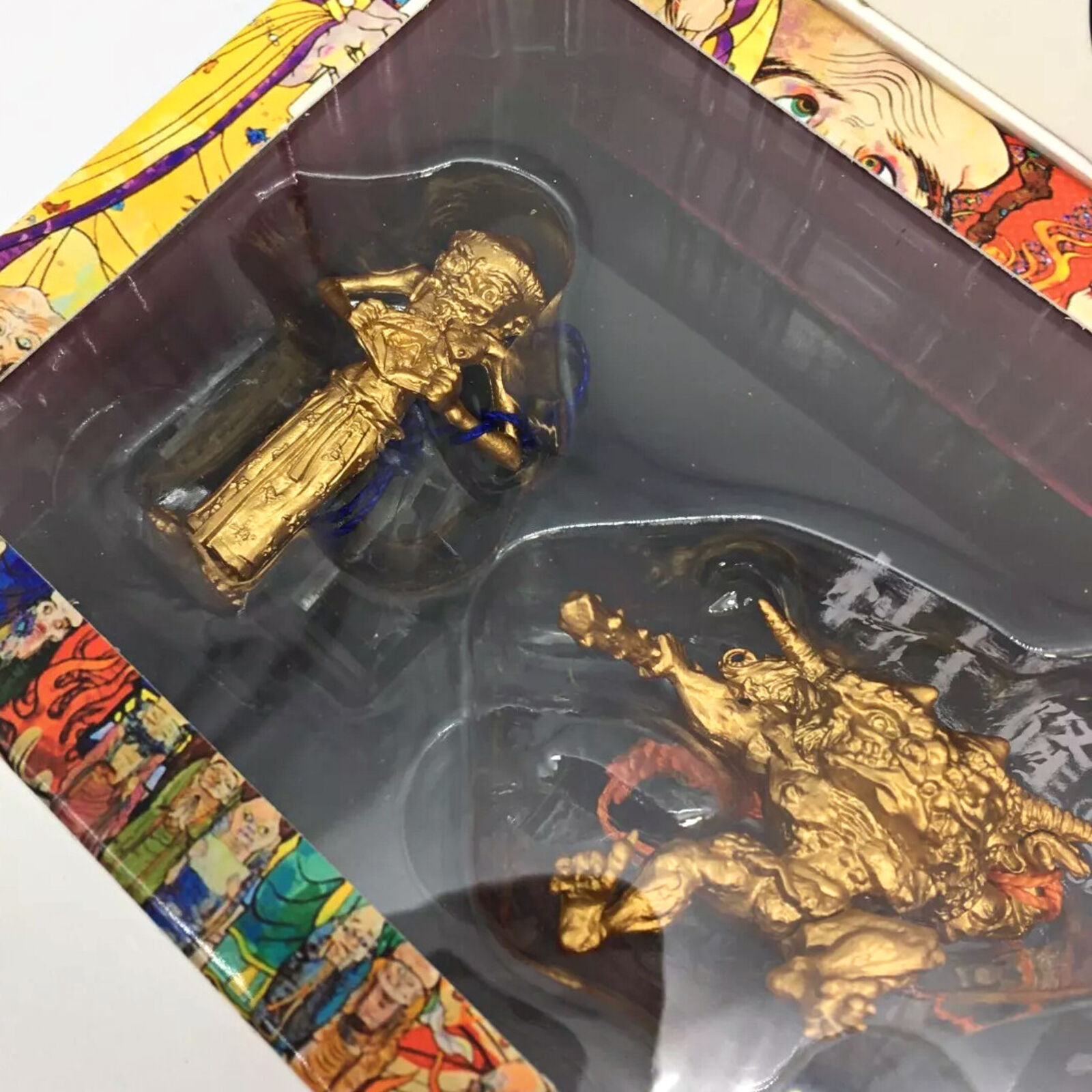 A box containing a variety of figurines in a display case.