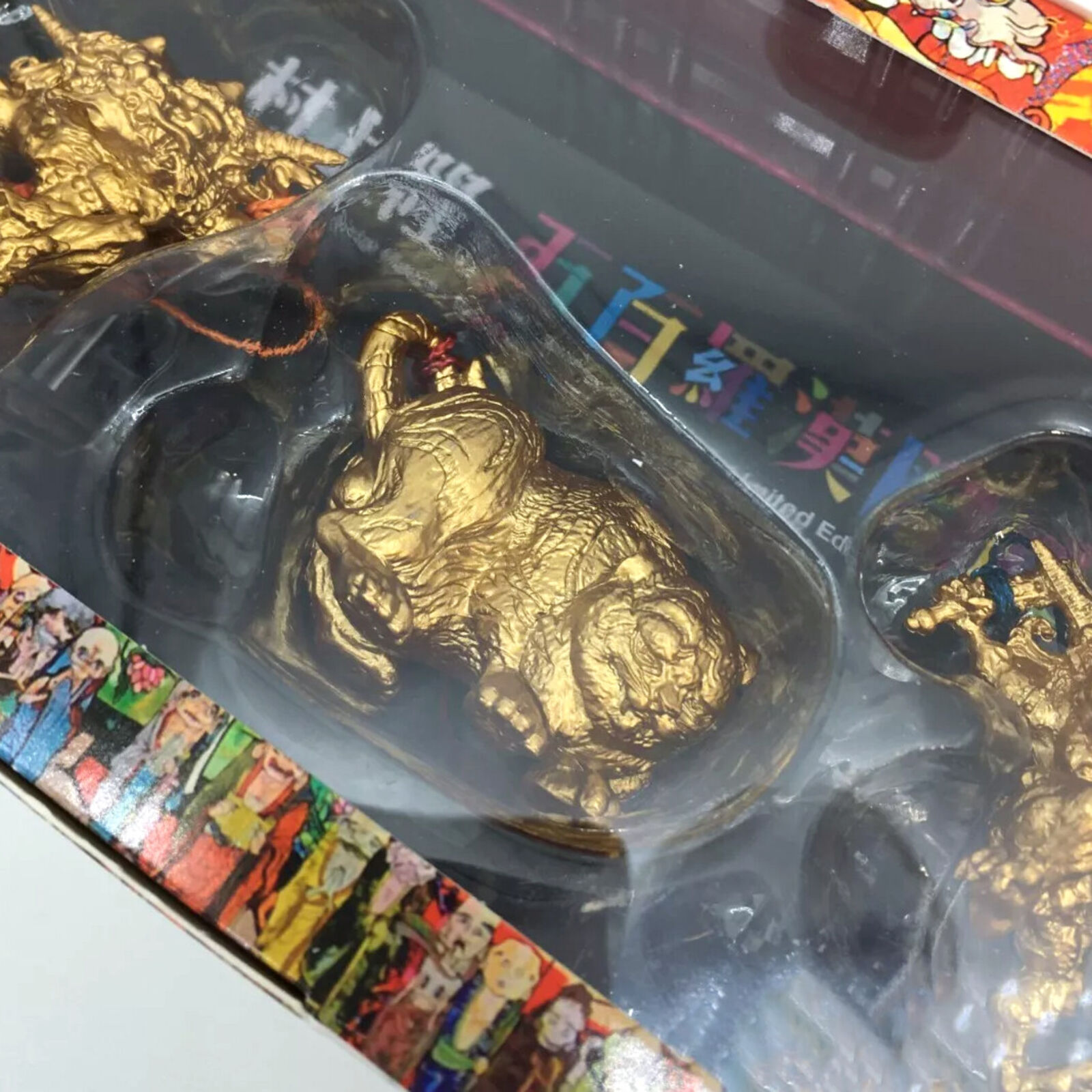A box containing a variety of figurines in a display case.