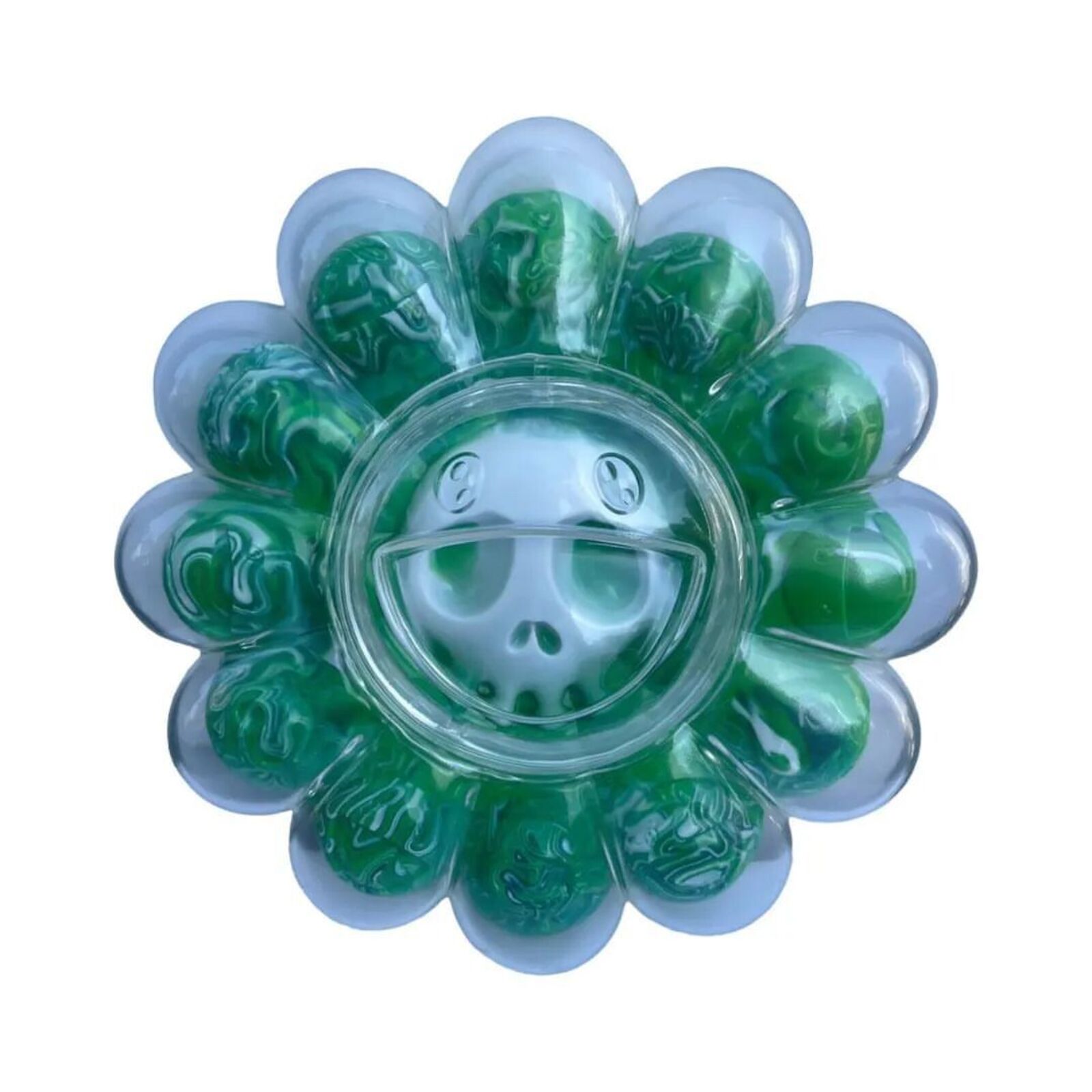 A flower shaped container filled with green gummy bears in it.