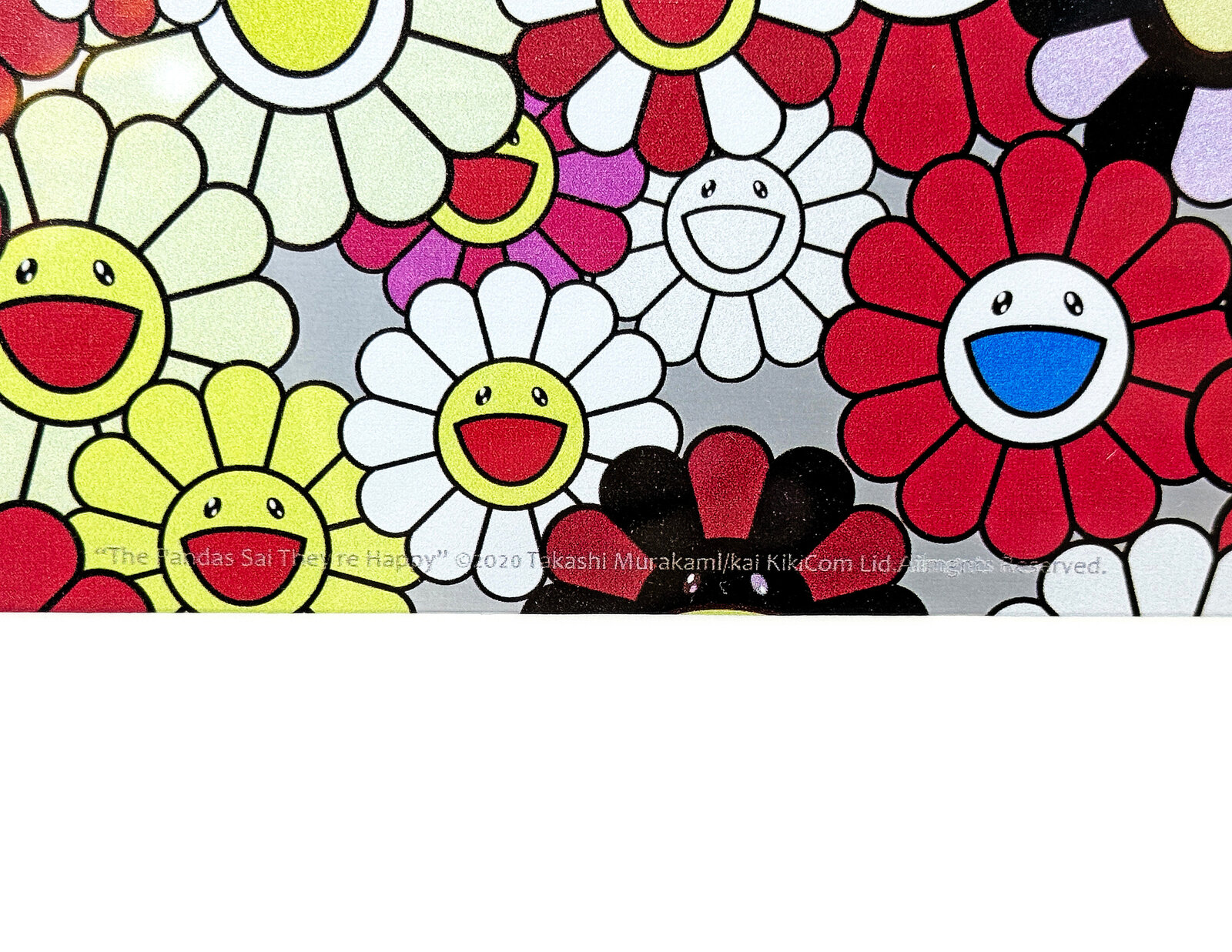 A dense, colorful mosaic of smiling flowers in a vibrant print.