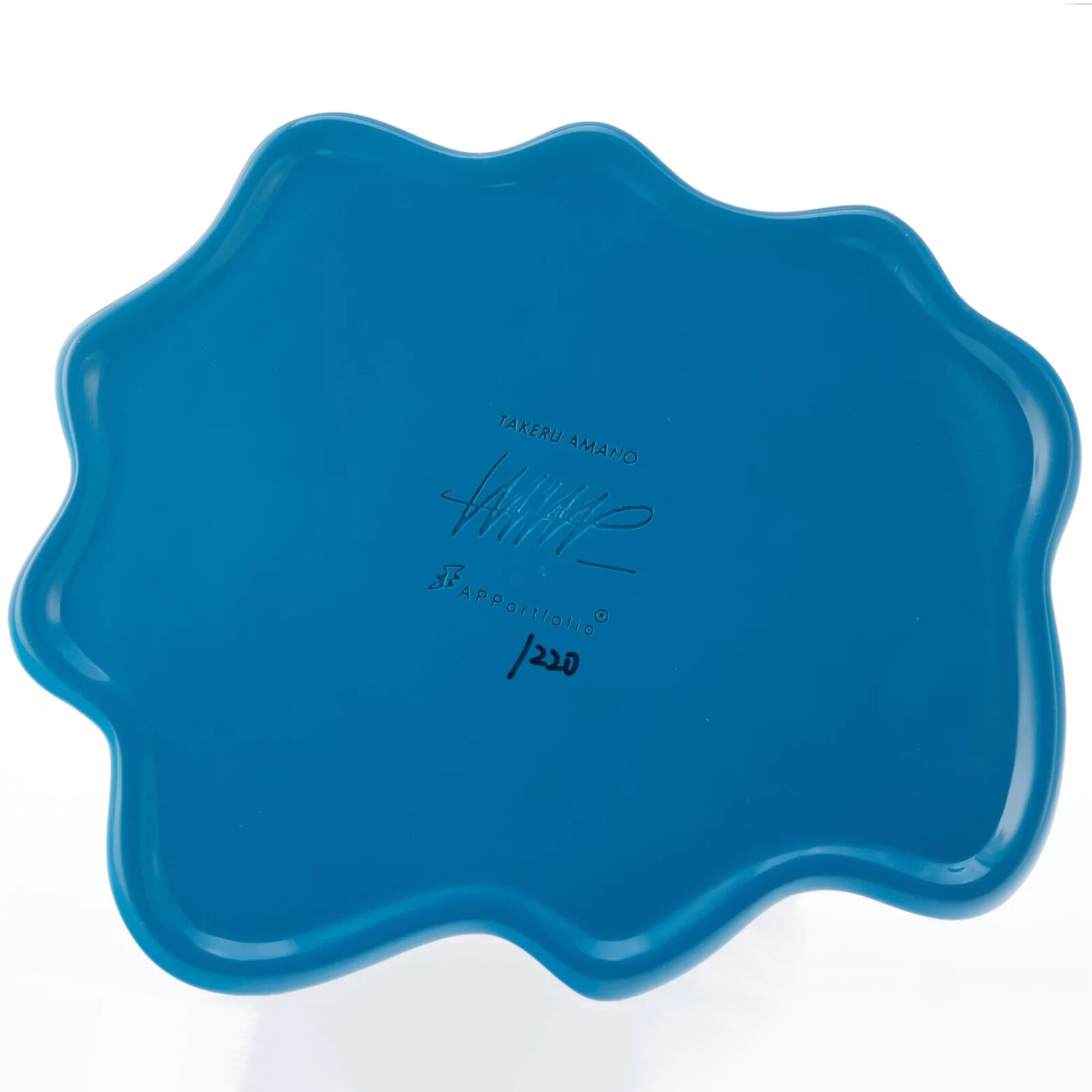 A figurine of a woman holding a fox in her arms.