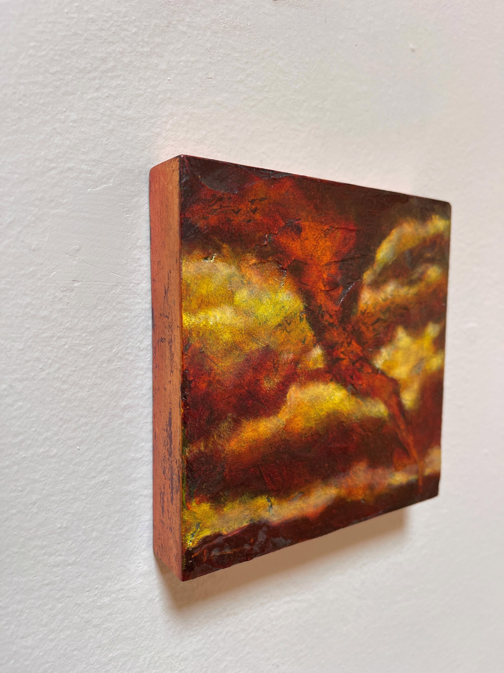 A painting of a tree in the middle of a field.