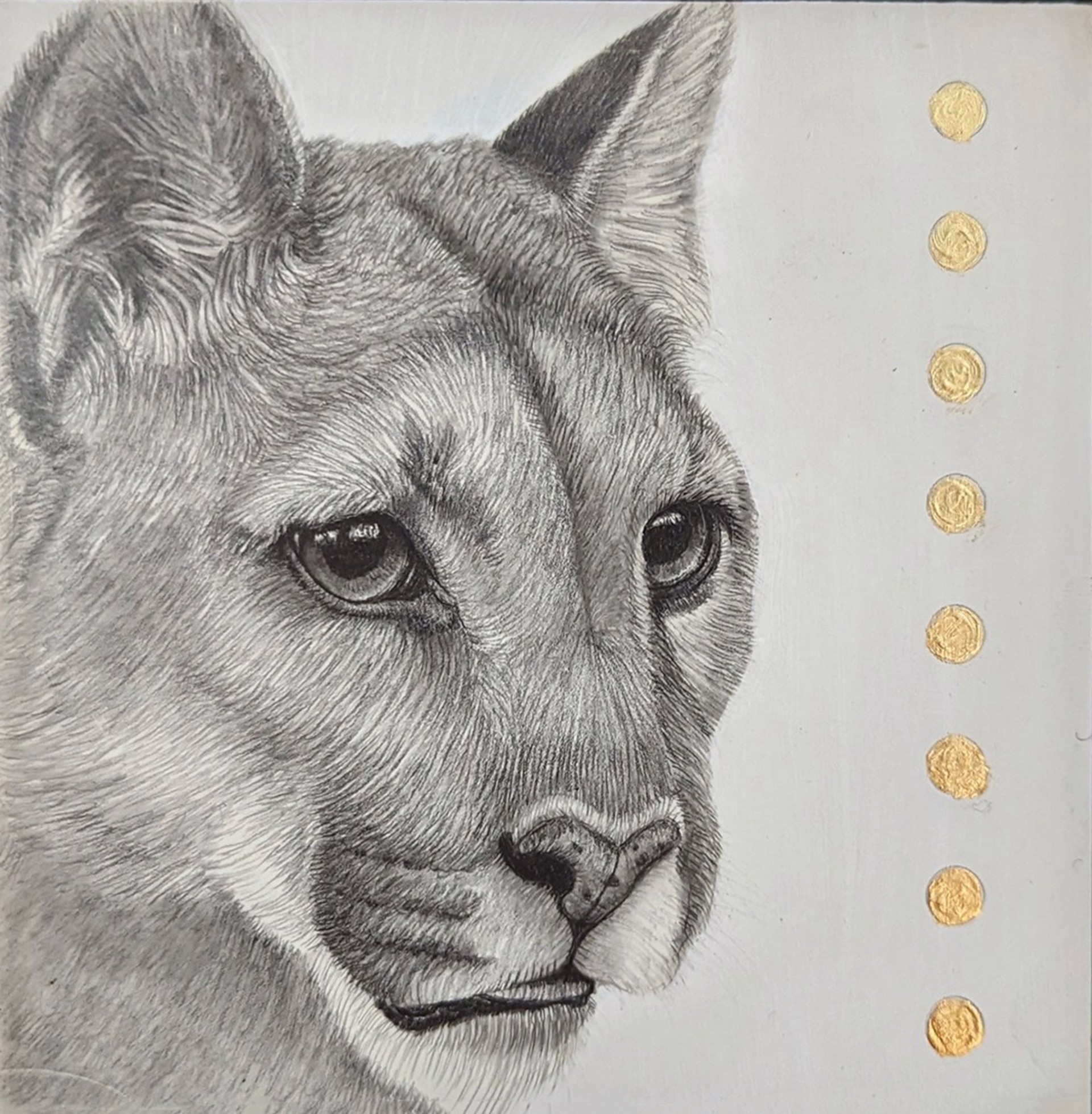 A drawing of a cougar's face on a piece of paper.