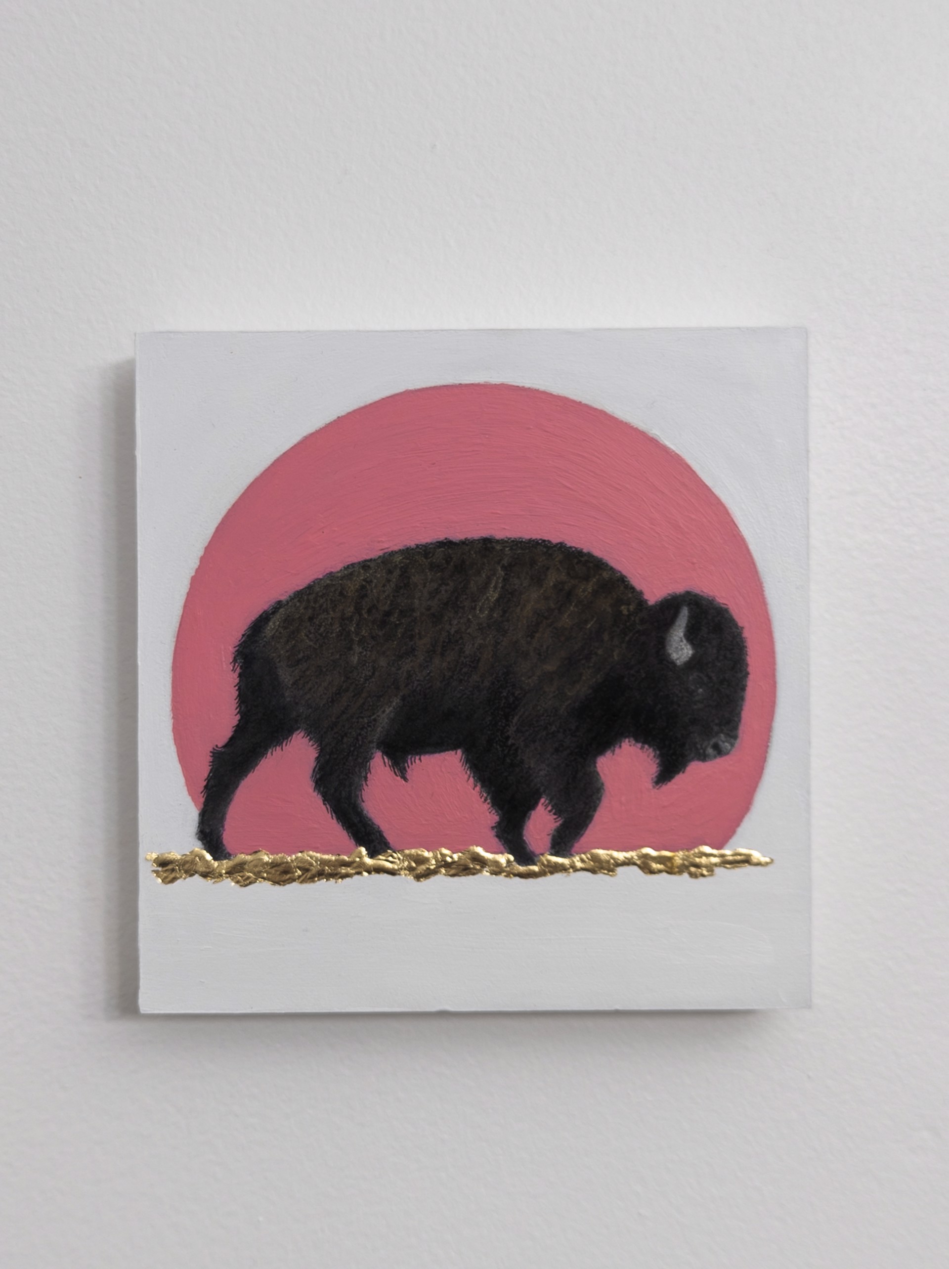A painting of a bison standing in front of a pink sun.