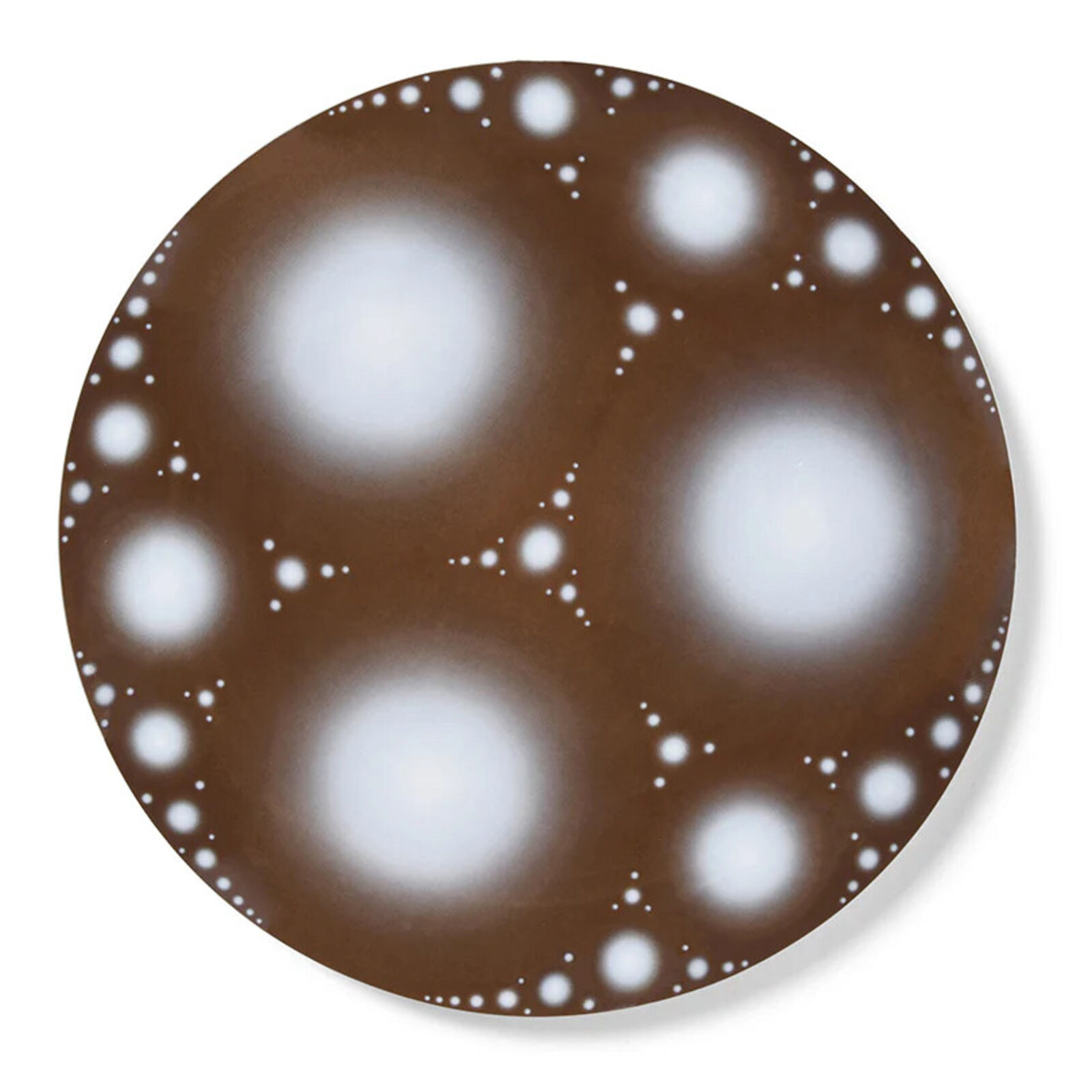 A brown and white plate with white dots on it.