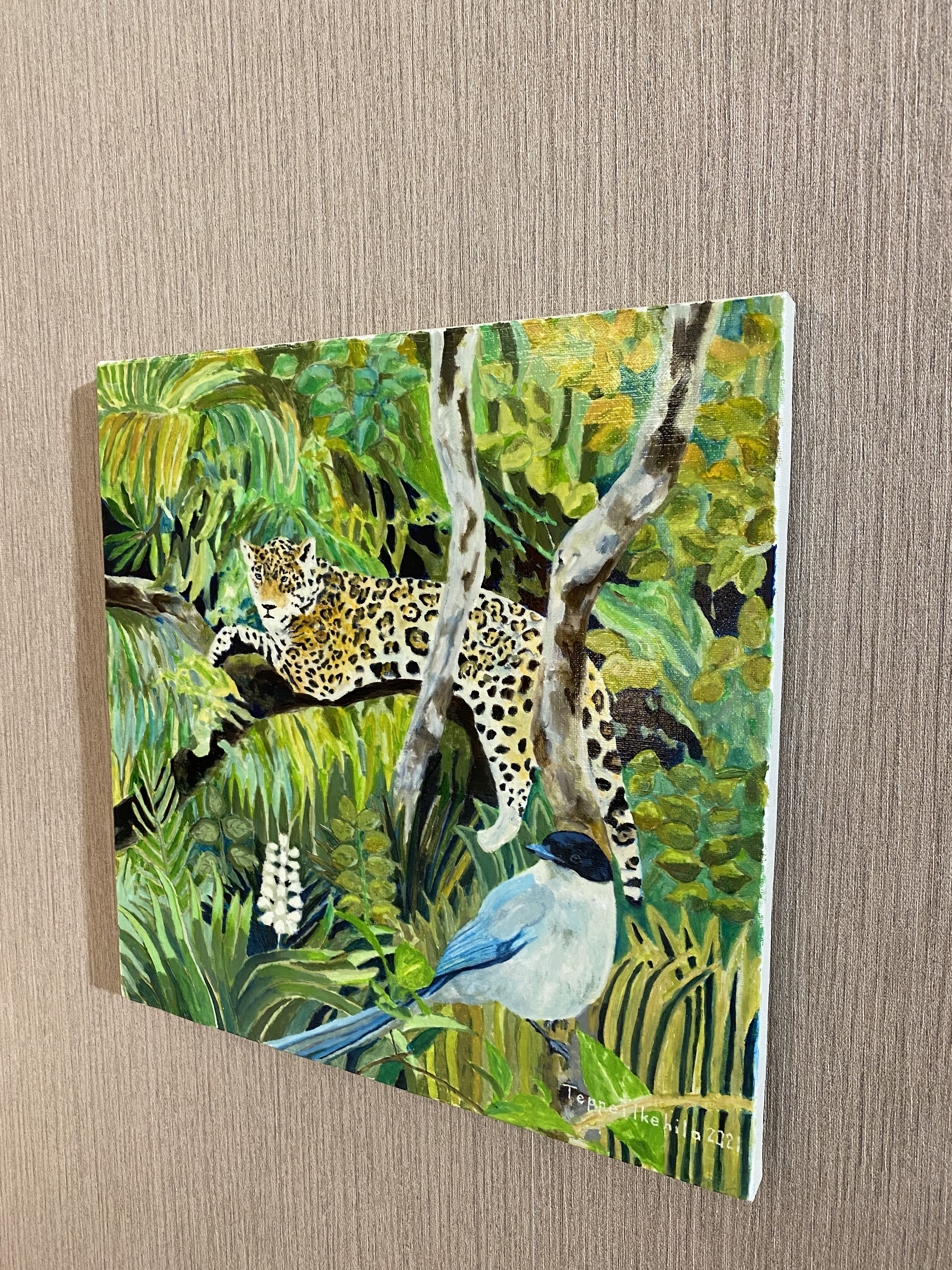 A vibrant painting of a spotted feline resting on a branch above a blue bird in a lush jungle.