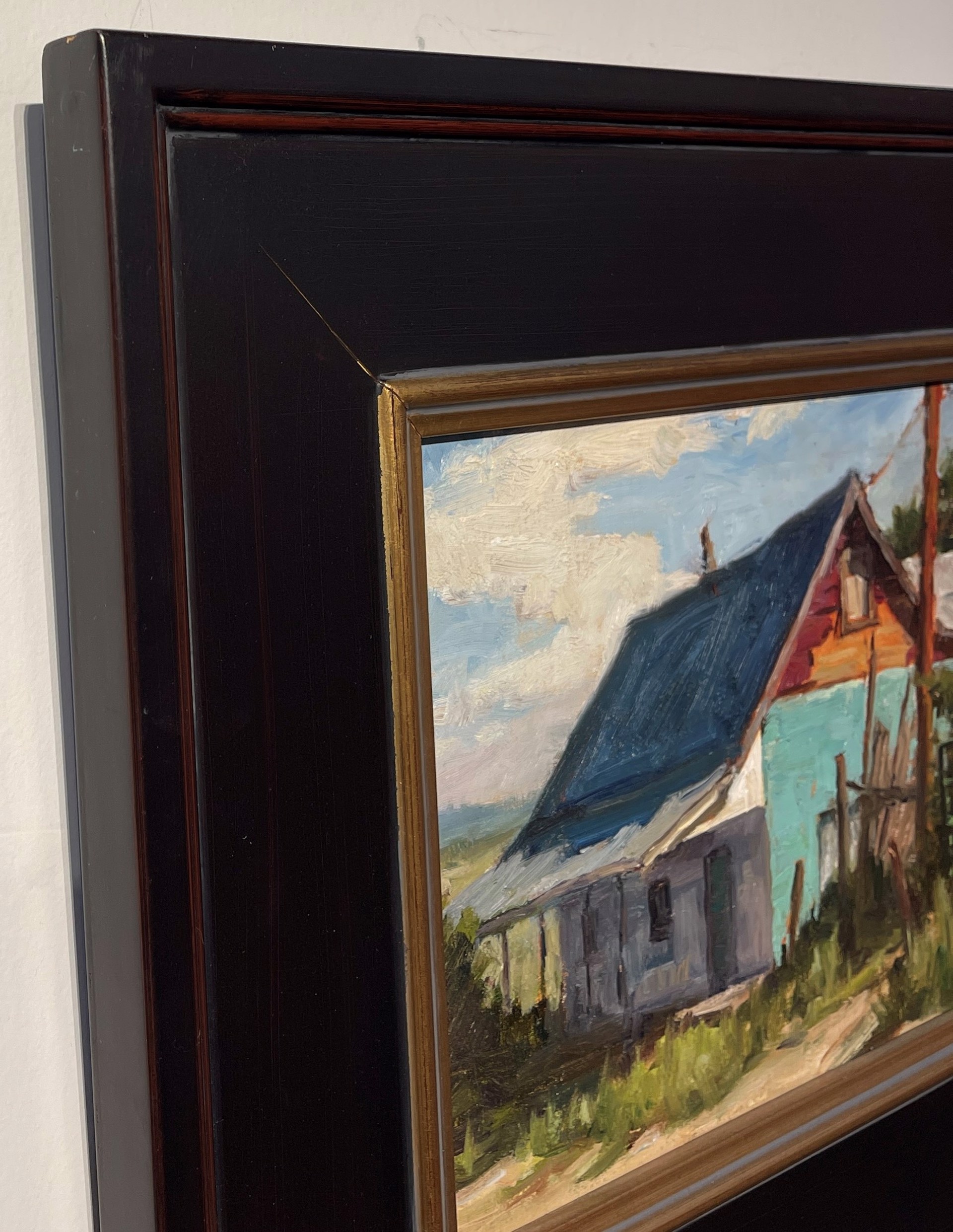 A painting of an old barn with a blue roof.