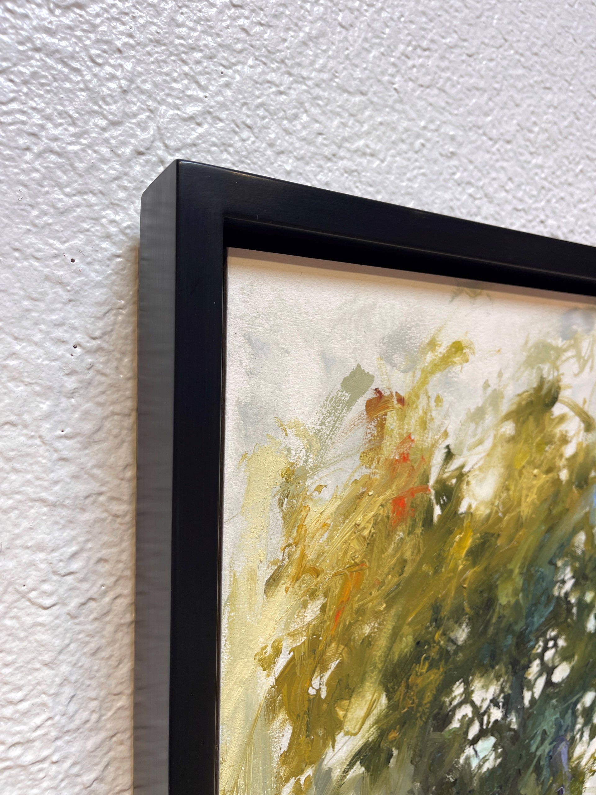 A painting of a vase filled with green and yellow flowers.