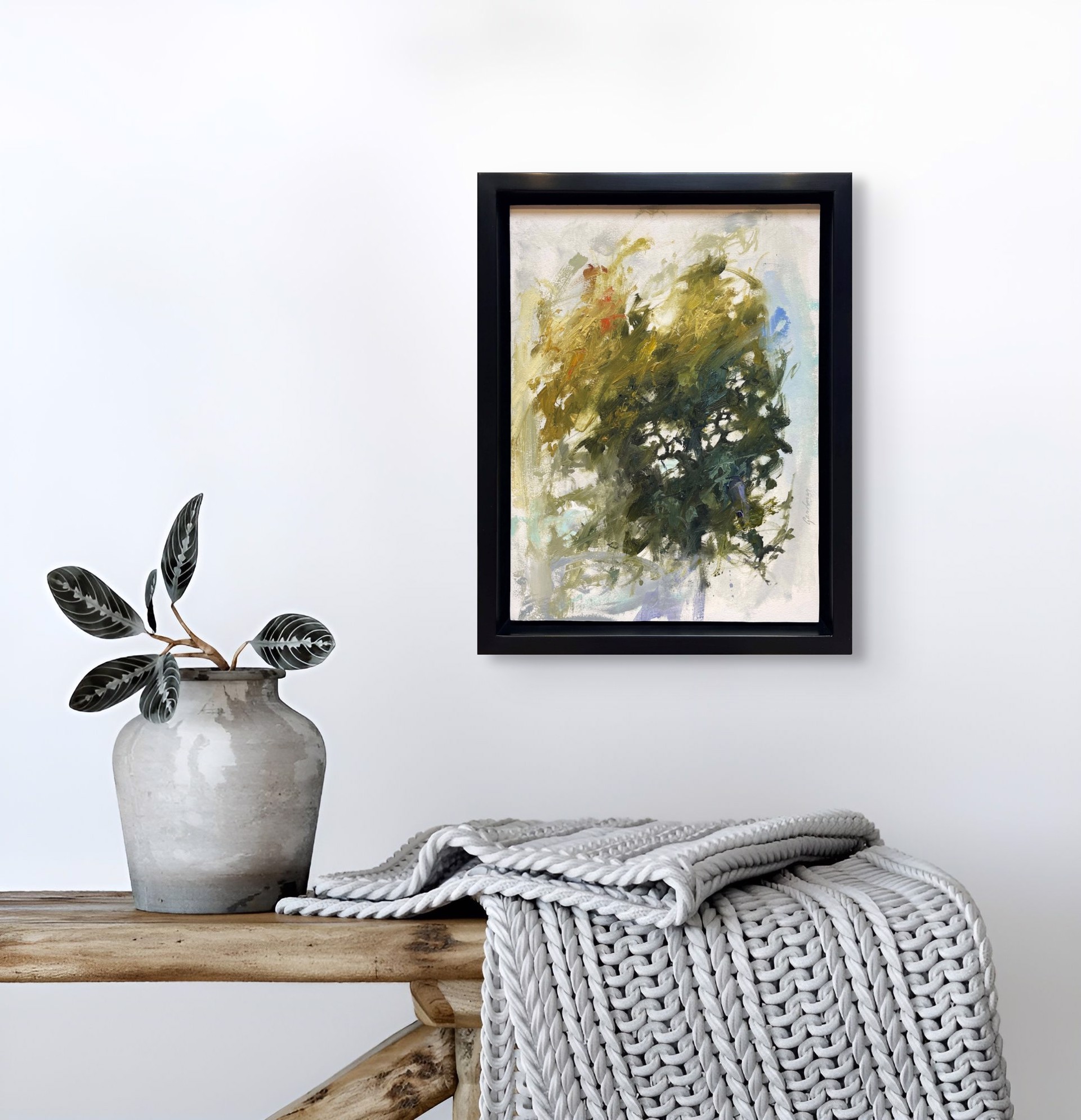 A painting of a vase filled with green and yellow flowers.