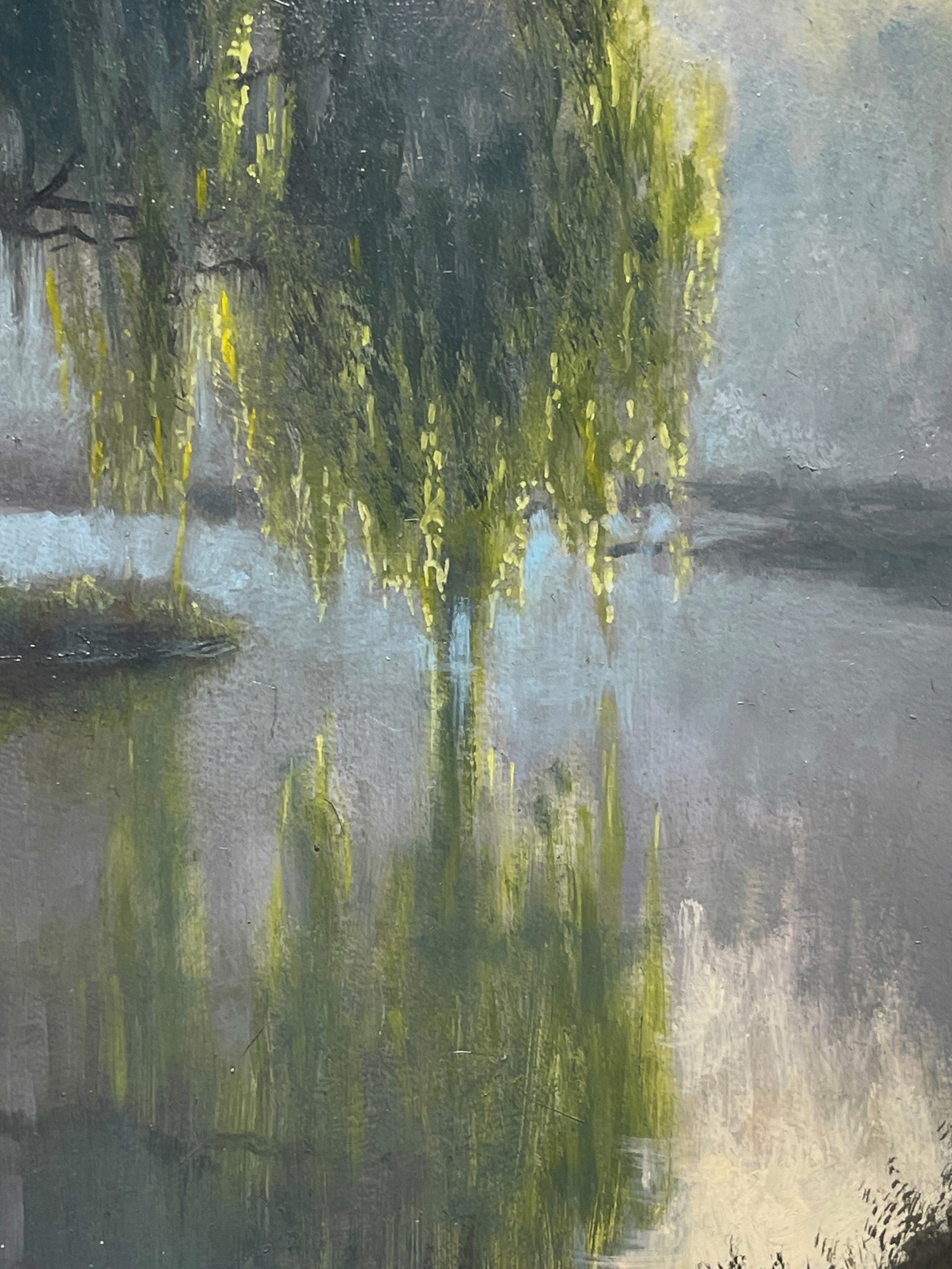 A misty river scene with a weeping willow tree reflecting in calm water under soft morning light.