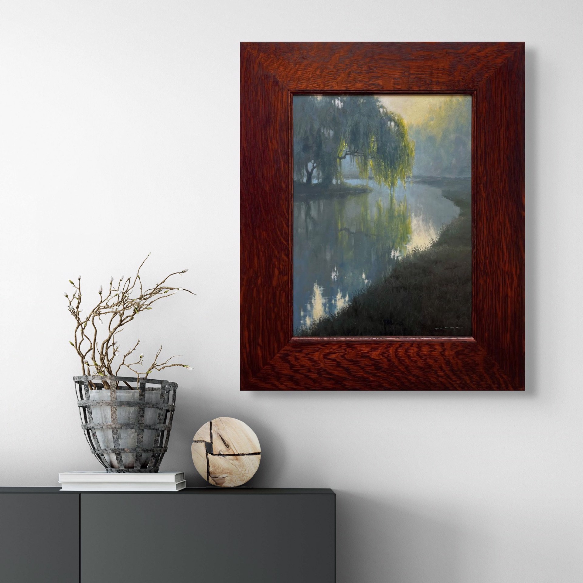 A misty river scene with a weeping willow tree reflecting in calm water under soft morning light.