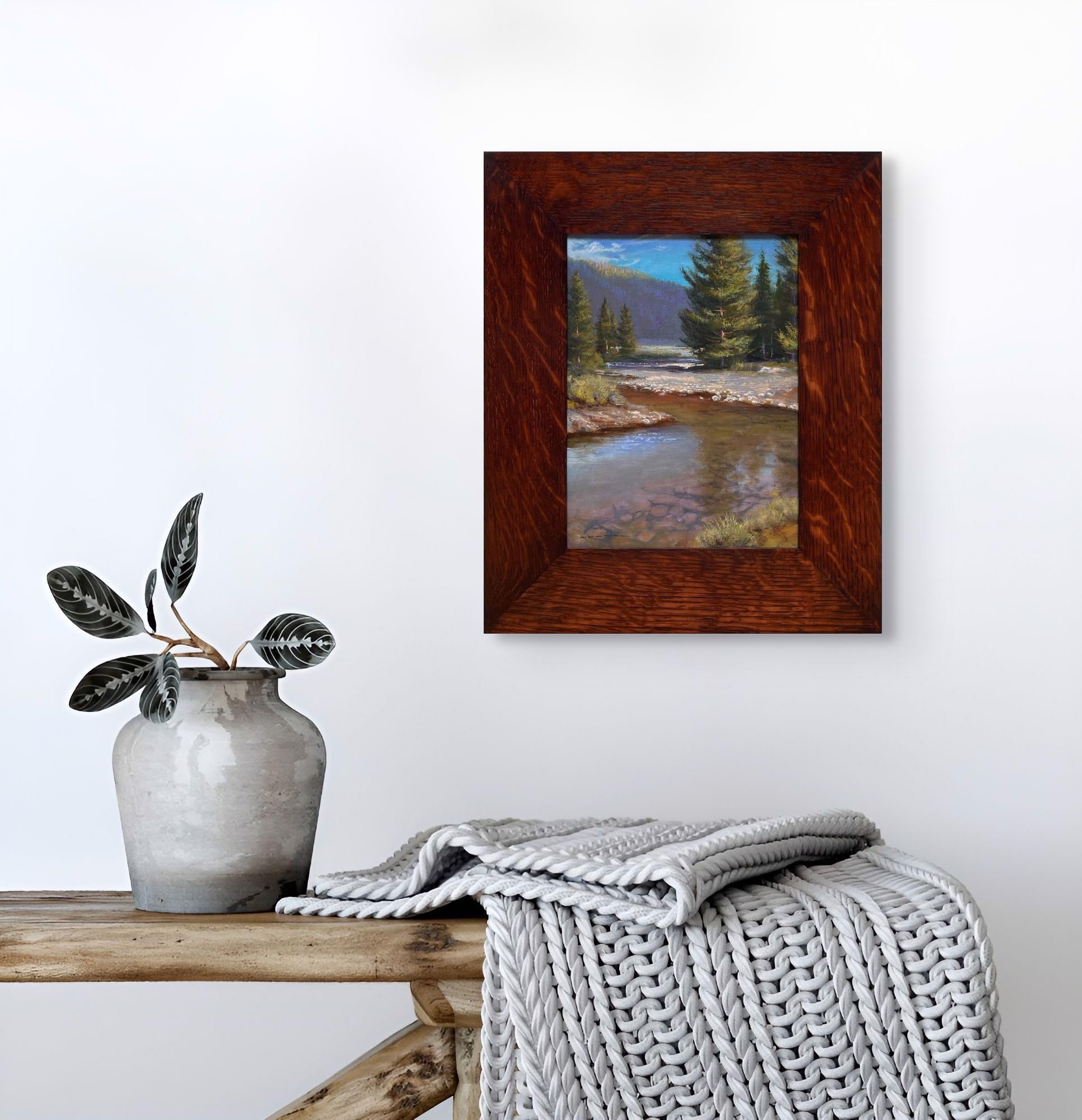 A painting of a river in the middle of a forest.