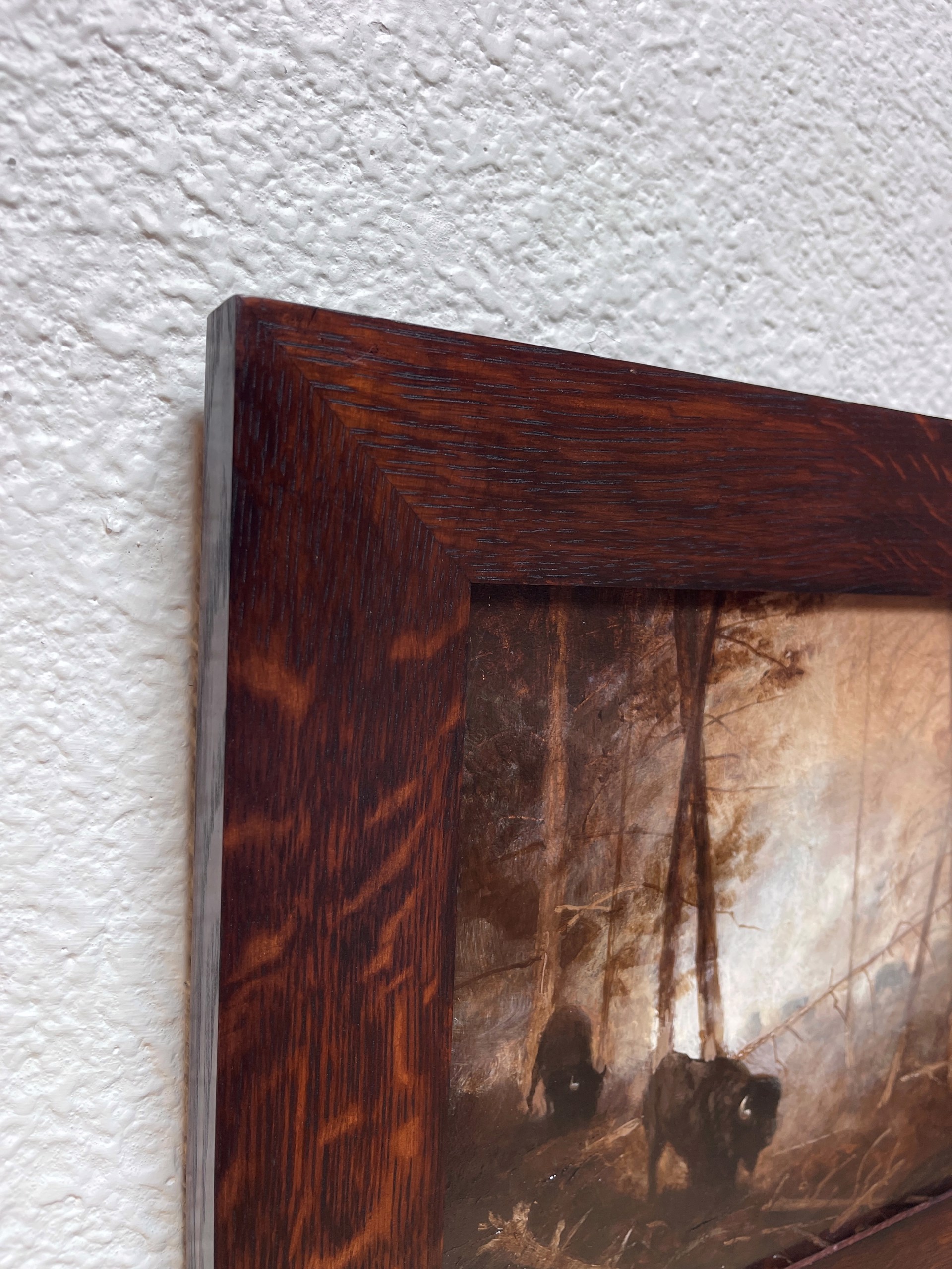 A painting of two bison in a wooded area in the woods.