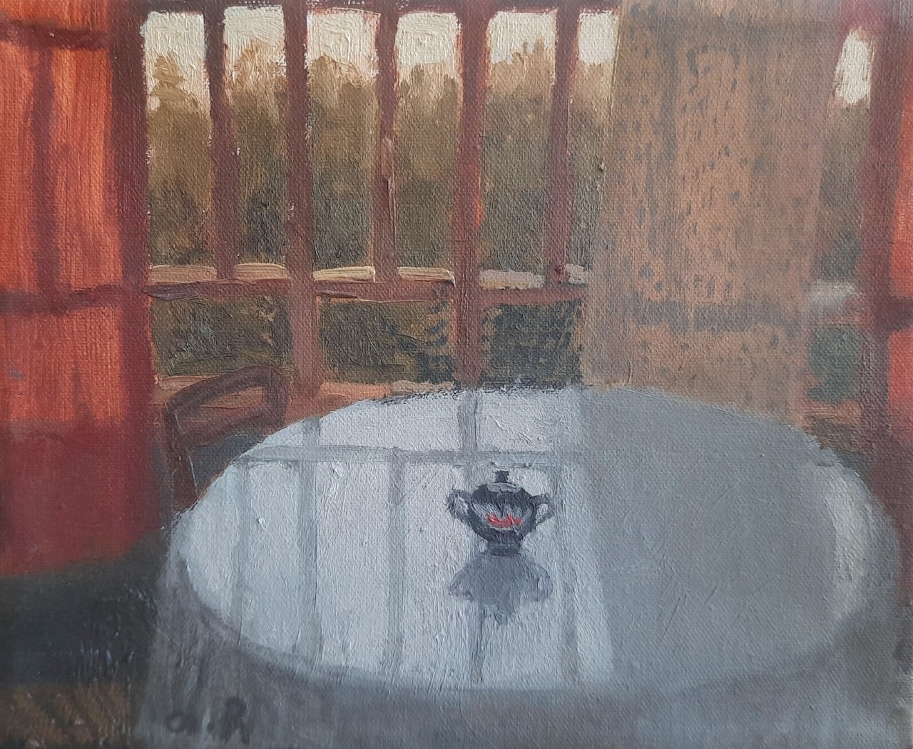 A quiet interior scene featuring a small teapot on a table near a window.